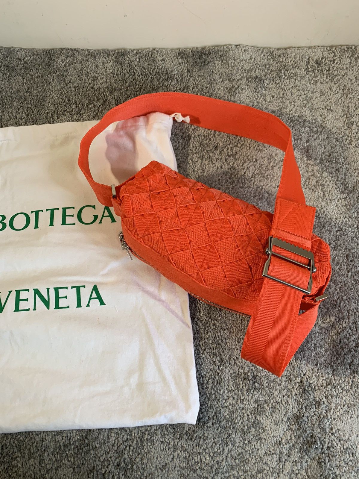 image of Bottega Veneta Intrecciato Tape Crossbody Bag in Orange, Men's