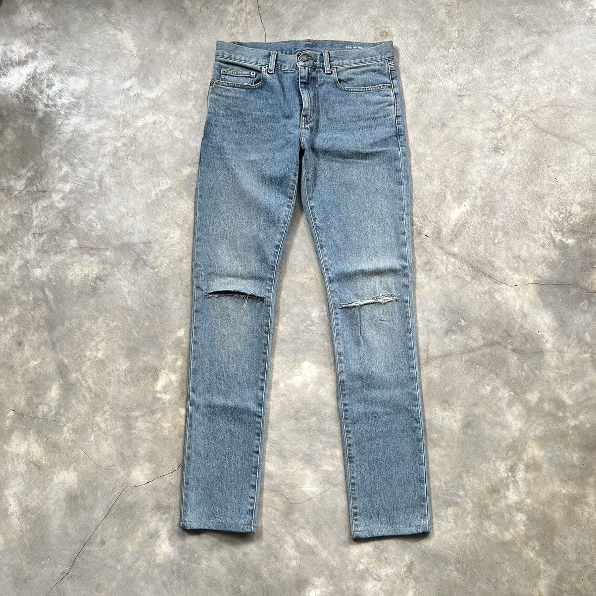 image of Hedi Slimane x Saint Laurent Paris Slim Fit Denim Ripped Pants in Indigo Blue, Men's (Size 29)