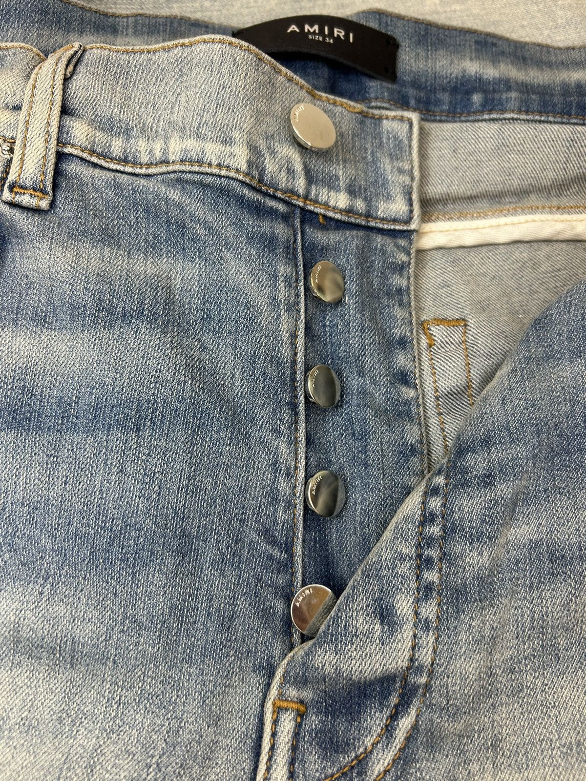 AMIRI MX1 CRACKED PAINT JEANS - CLAY INDIGO/PINK