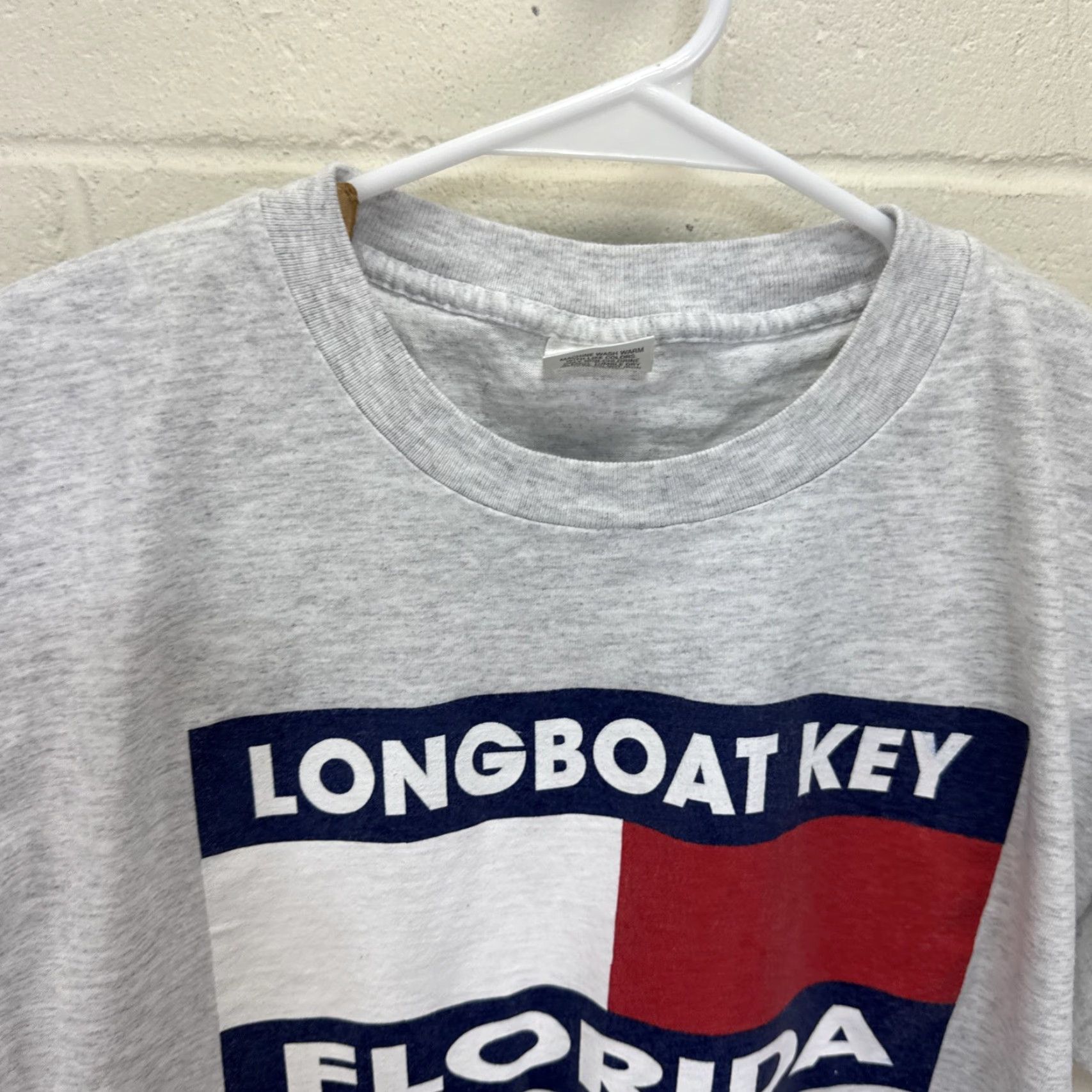 Tommy Hilfiger Vintage Murina LONGBOAT KEY FLORIDA T-SHIRT Gray Unisex Adults L Crew Neck Short Sleeve 90s USA Flag Graphic Floral Pattern? Wait no dais. Size US L / EU 52-54 / 3 - 5 Thumbnail
