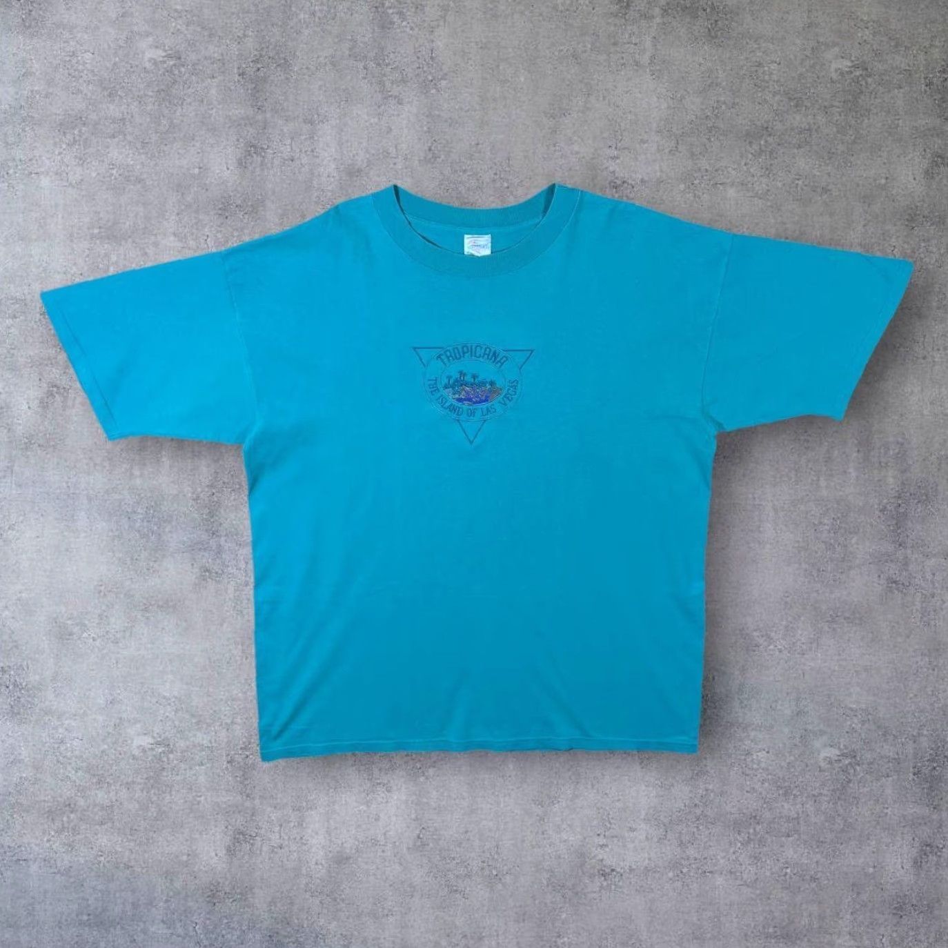 Vintage Vintage Tropicana The Island Of Las Vegas Embroidered Single Stitch T-Shirt XXL Desert Heat Men 2XL Turquoise Vintage 90s Mens Shirt Size US XXL / EU 58 / 5 - 2 Thumbnail