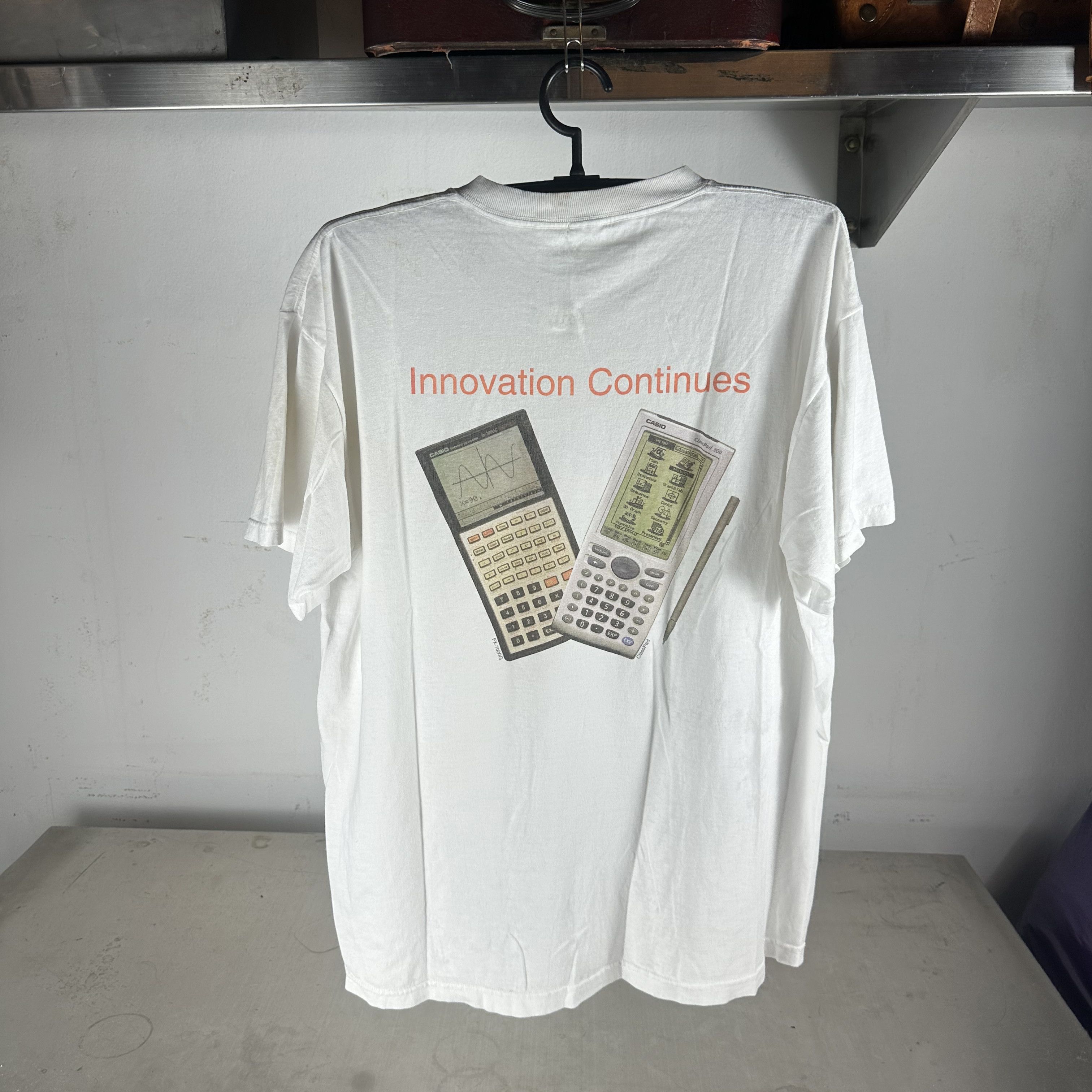 Vintage 90s Casio Innovation Continues Calculator Promo T-shirt Size US XL / EU 56 / 4 - 1 Thumbnail