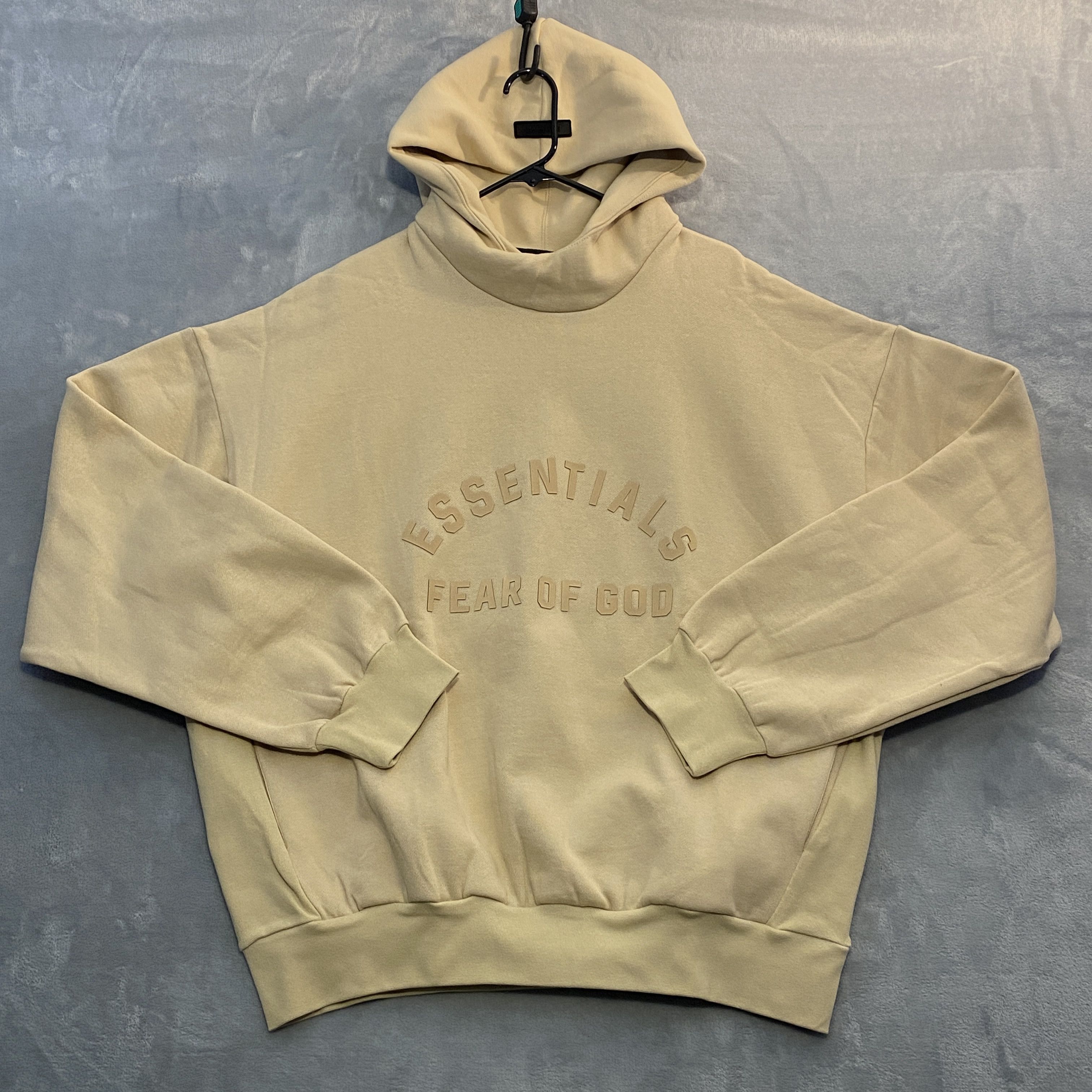 image of Fear Of God Essentials Hoodie Large Loose Arch Logo Spell Out Applique in Beige, Men's