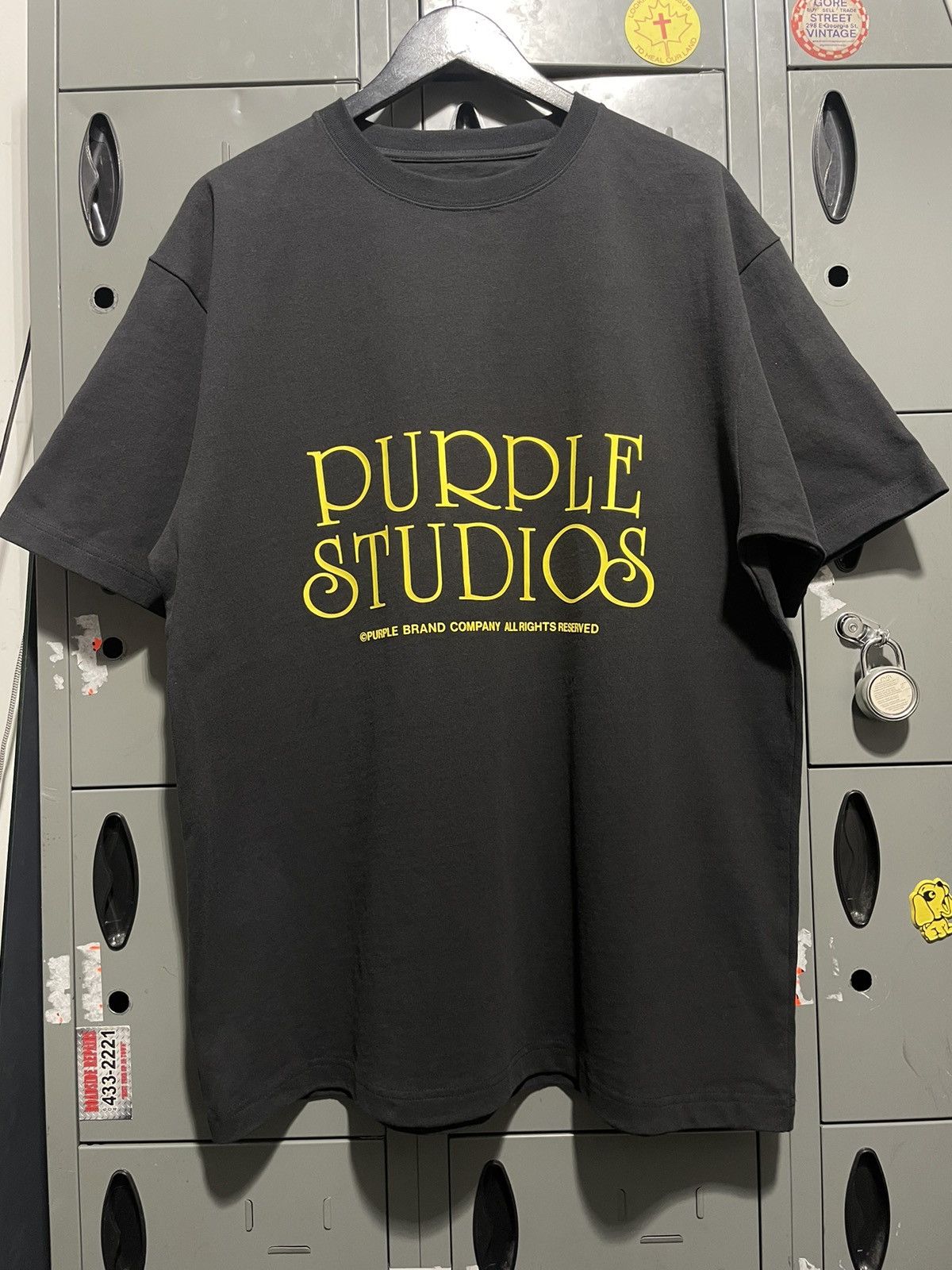 image of Purple Studios Purple Brand Company Old Movie Font Text in Black, Men's (Size XL)