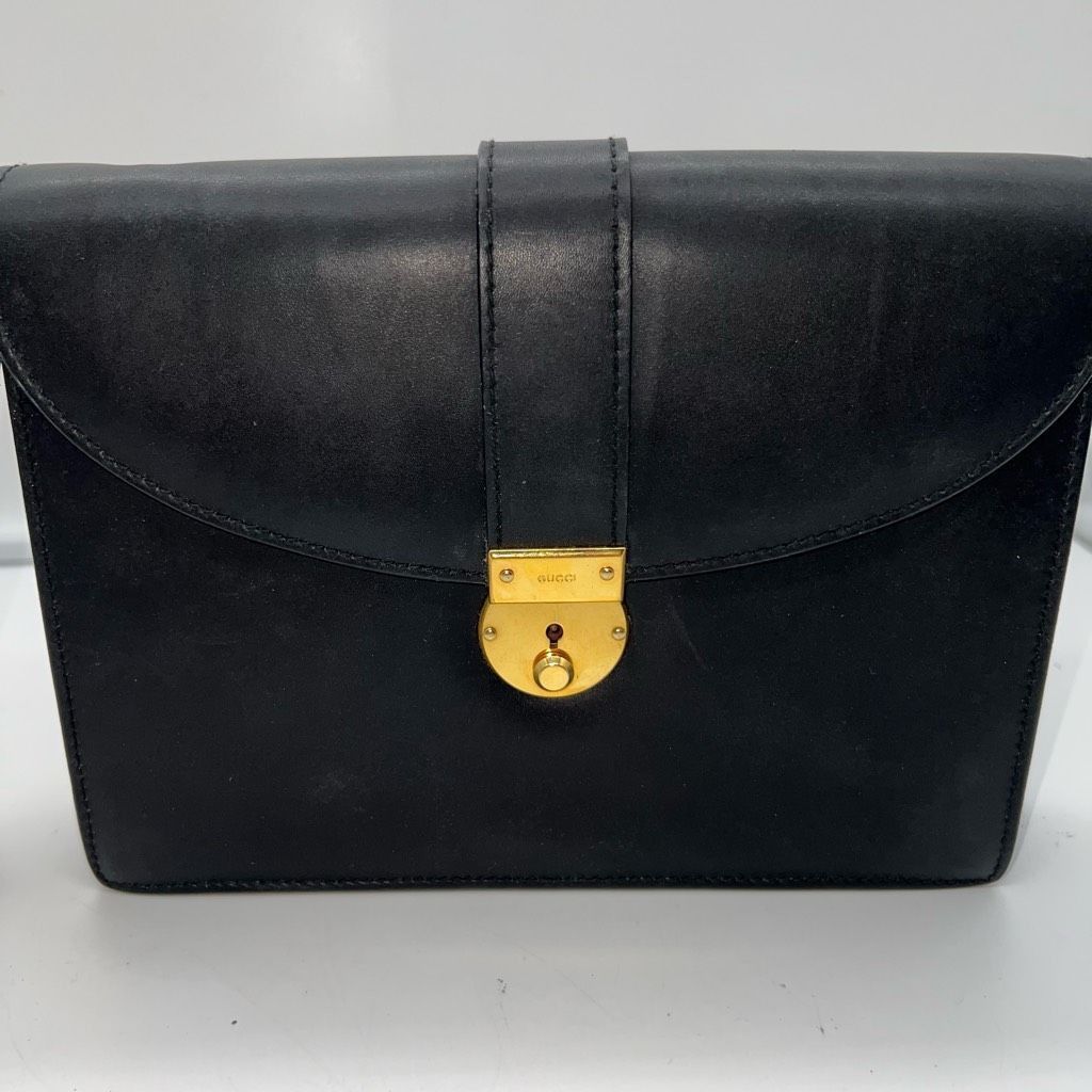 image of Gucci Calf Leather Gold Tone Lock Clutch Bag in Black, Women's