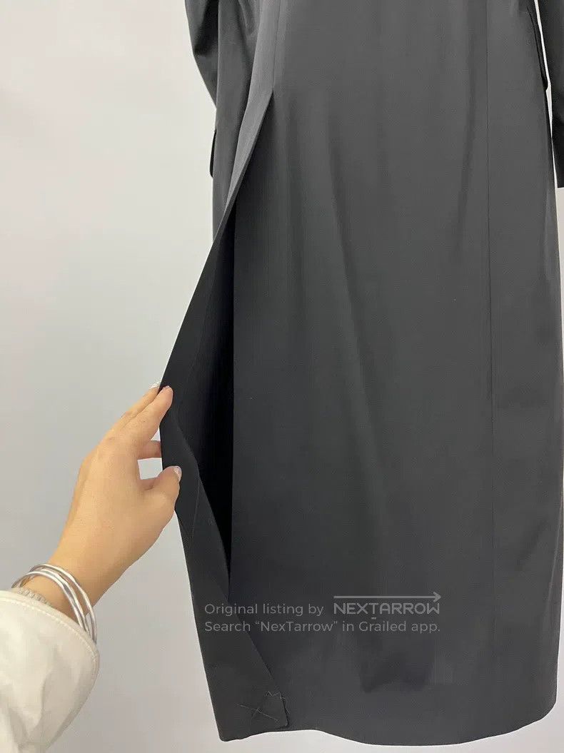 The row Black windbreaker coat