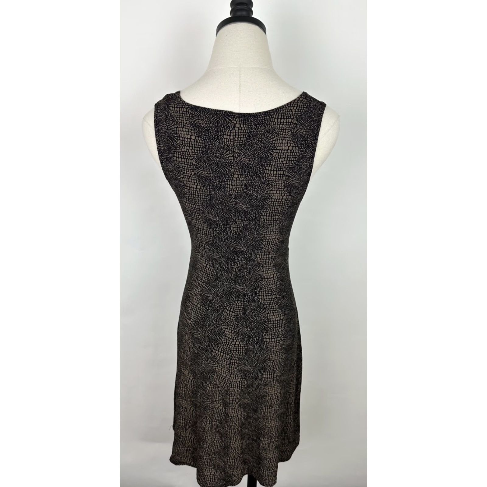 surplice empire waist dress Empire Waist Metallic Knit Dress with Surplice Neckline, Flutter Sleeves, Embellishment Detail at Hip and Cascade Skirt