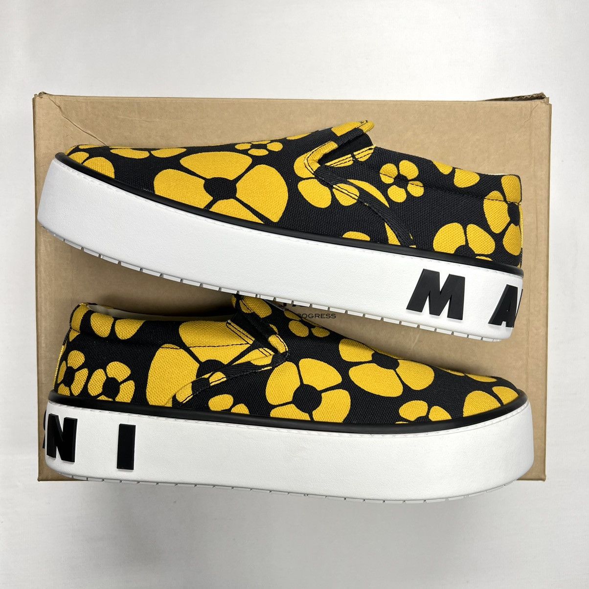 image of Carhartt Wip Slip On Low Sneaker Black Yellow Flower in Black/Yellow, Men's (Size 10)