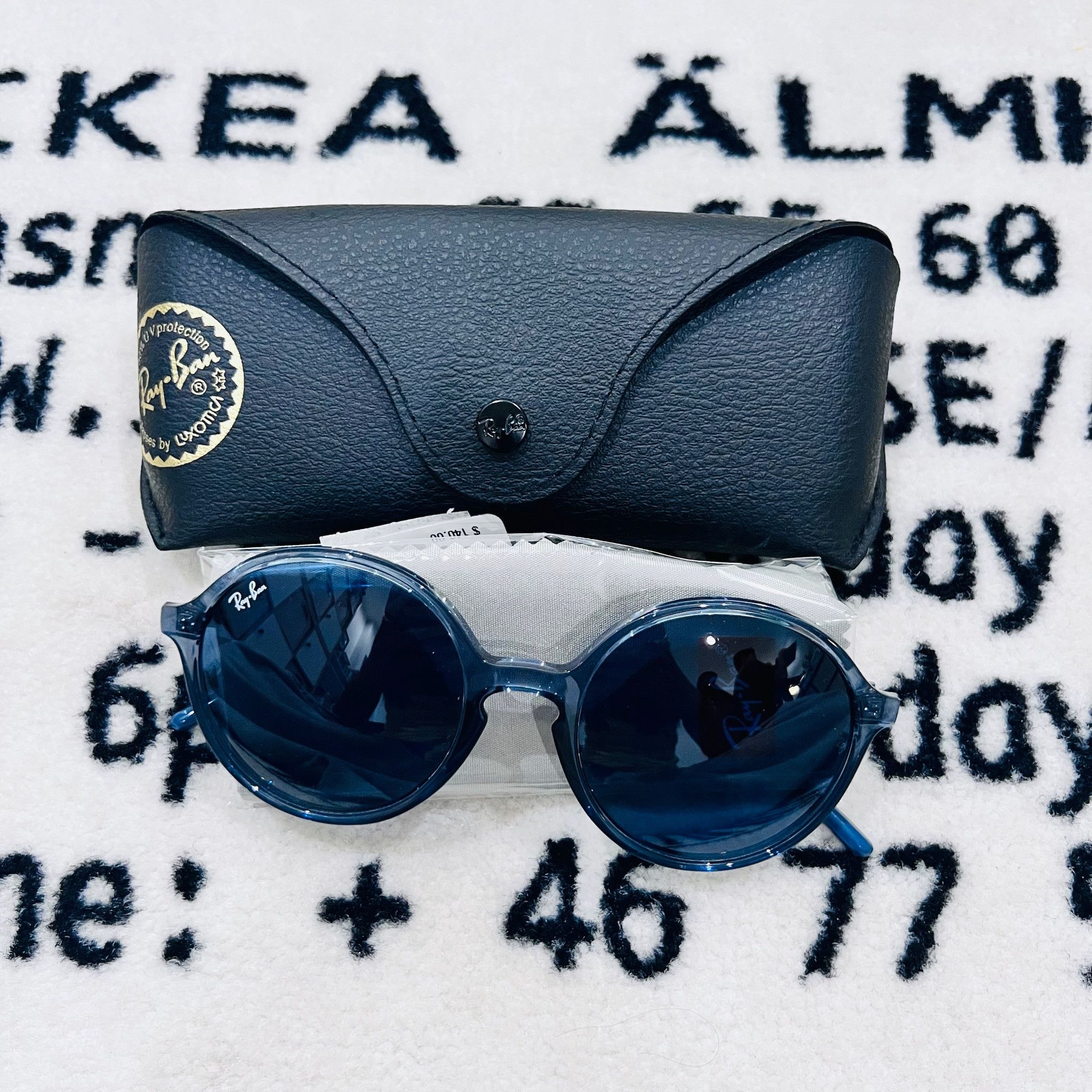 RayBan RayBan RB4304 Round Polished Transparent Blue Sunglasses Size ONE SIZE - 1 Thumbnail