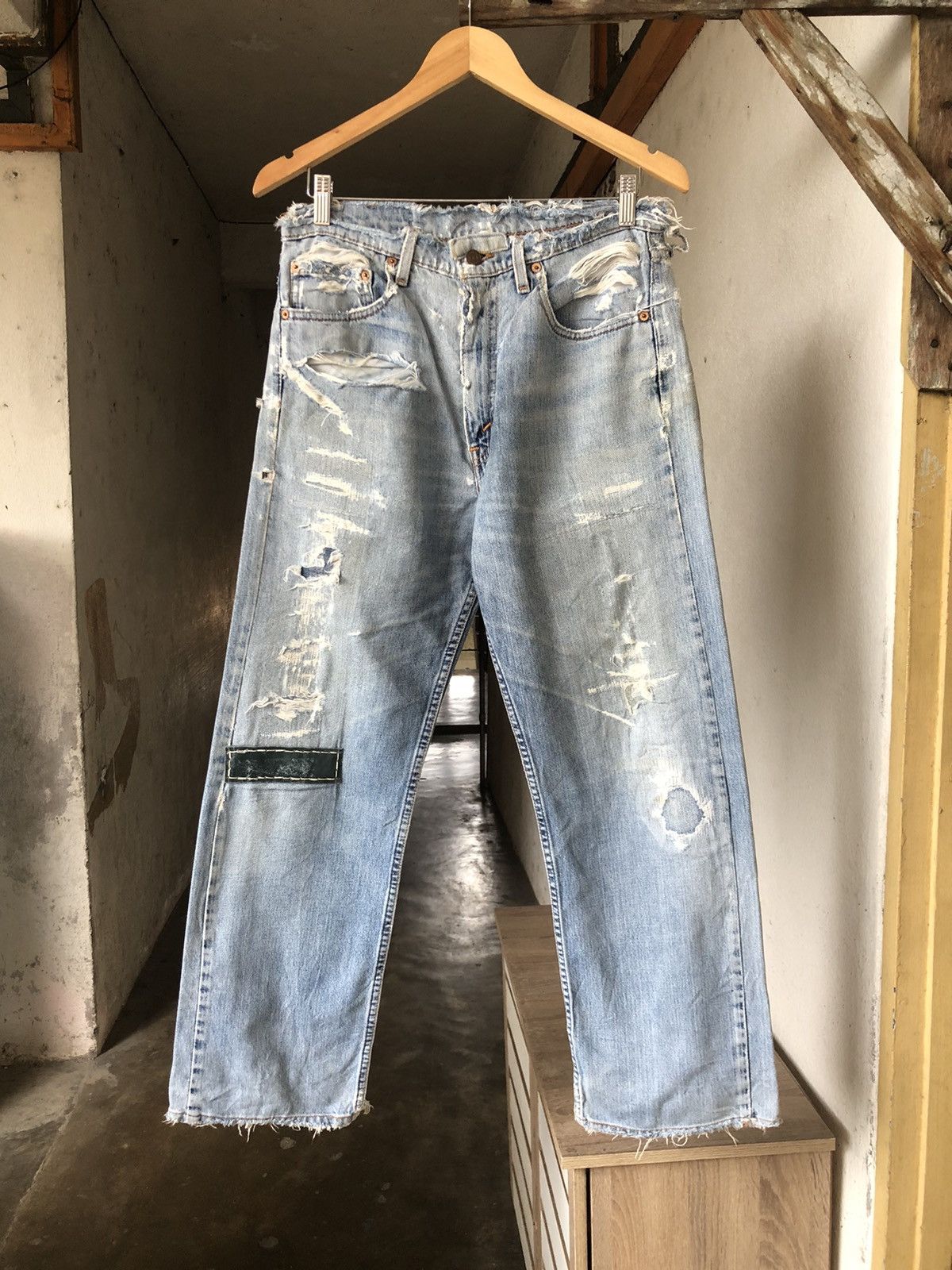 image of Distressed Denim x Levis Vintage 90's Levis Distressed Patches Loose Fit Jeans in Light Blue (Size 