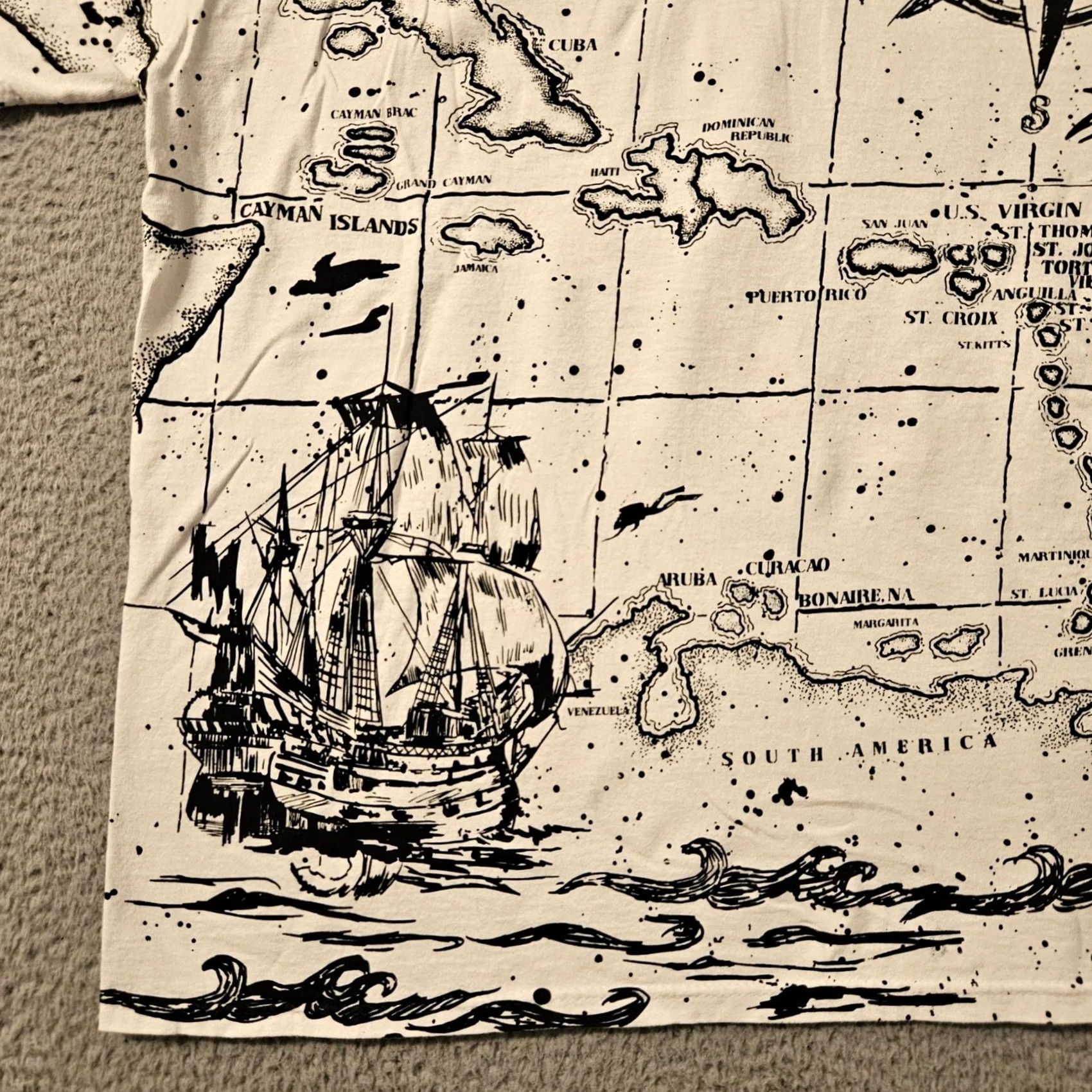 Delta VINTAGE Stanley Michaels AOP Map Caribbean Parrot Pirate Ship Graphic Shirt XL White Stain 29.5 22.5 Inches Mens Size US XL / EU 56 / 4 - 7 Thumbnail