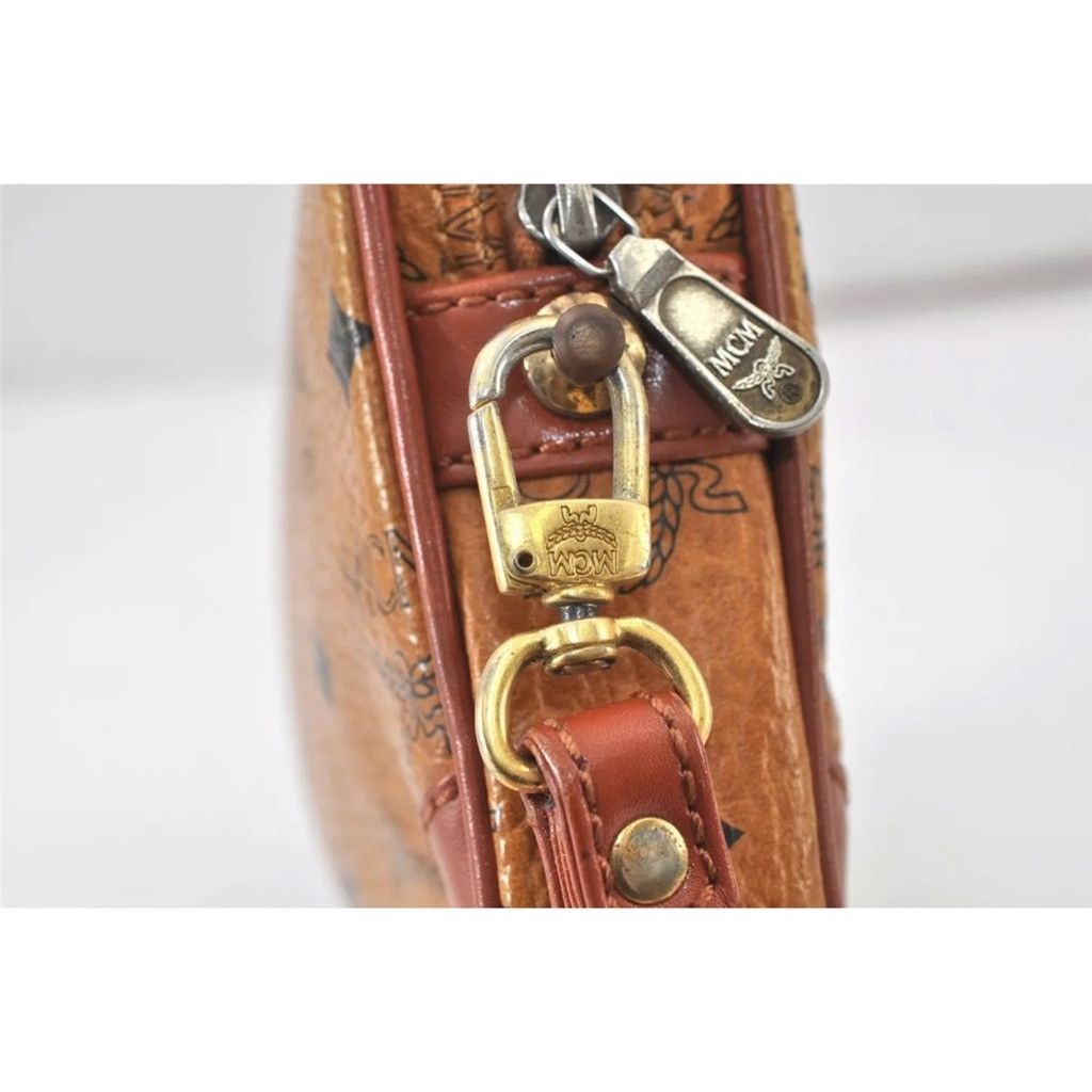 MCM MCM Brown Clutch with Logo Pattern and Wrist Strap Size ONE SIZE - 13 Thumbnail