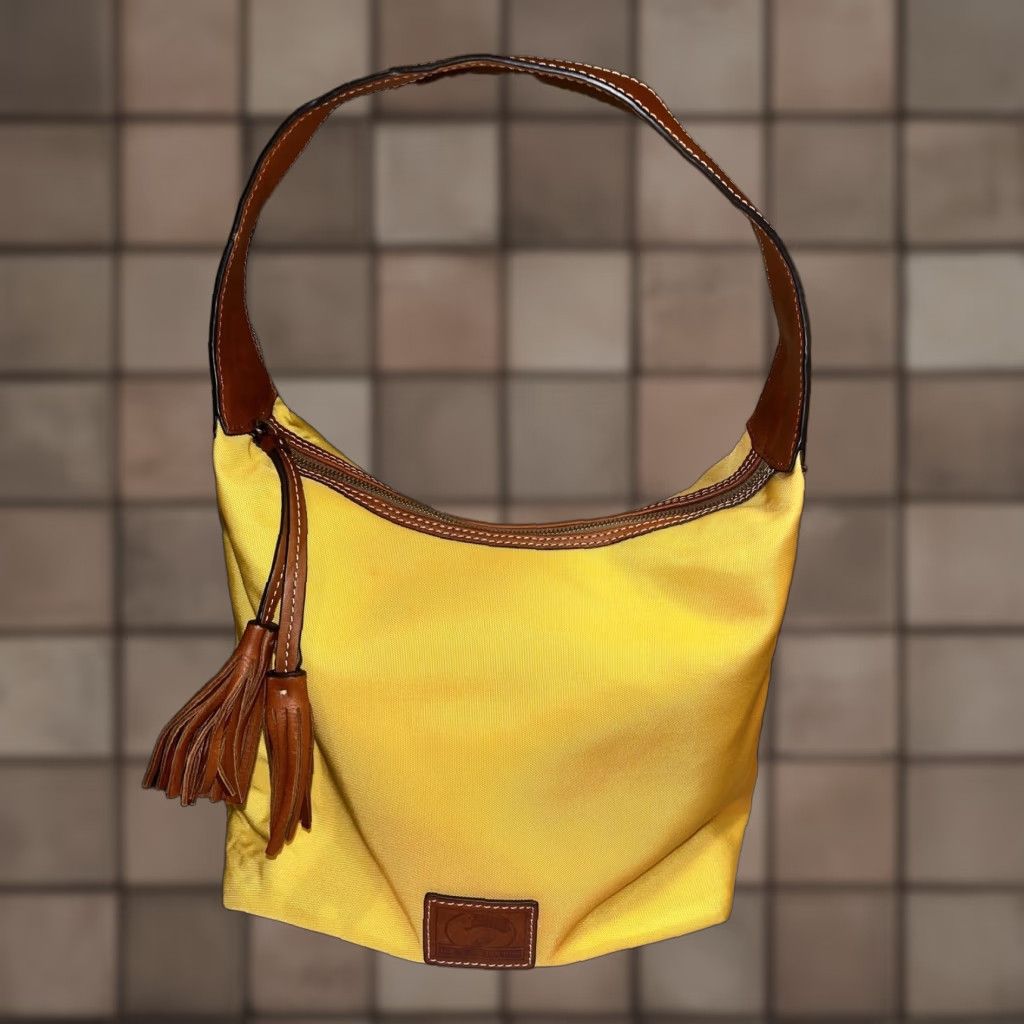 Dooney & Bourke Dooney & Bourke Yellow Canvas Hobo Style Handbag Leather Strap & Tassel Size ONE SIZE - 1 Thumbnail