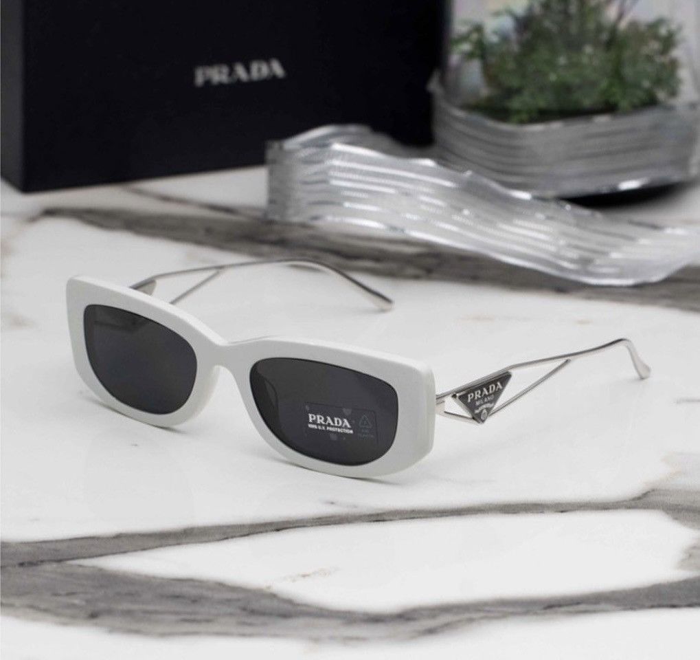 image of Designer Sunglasses. Prada Pr 14Ys 1425S0 in White, Women's