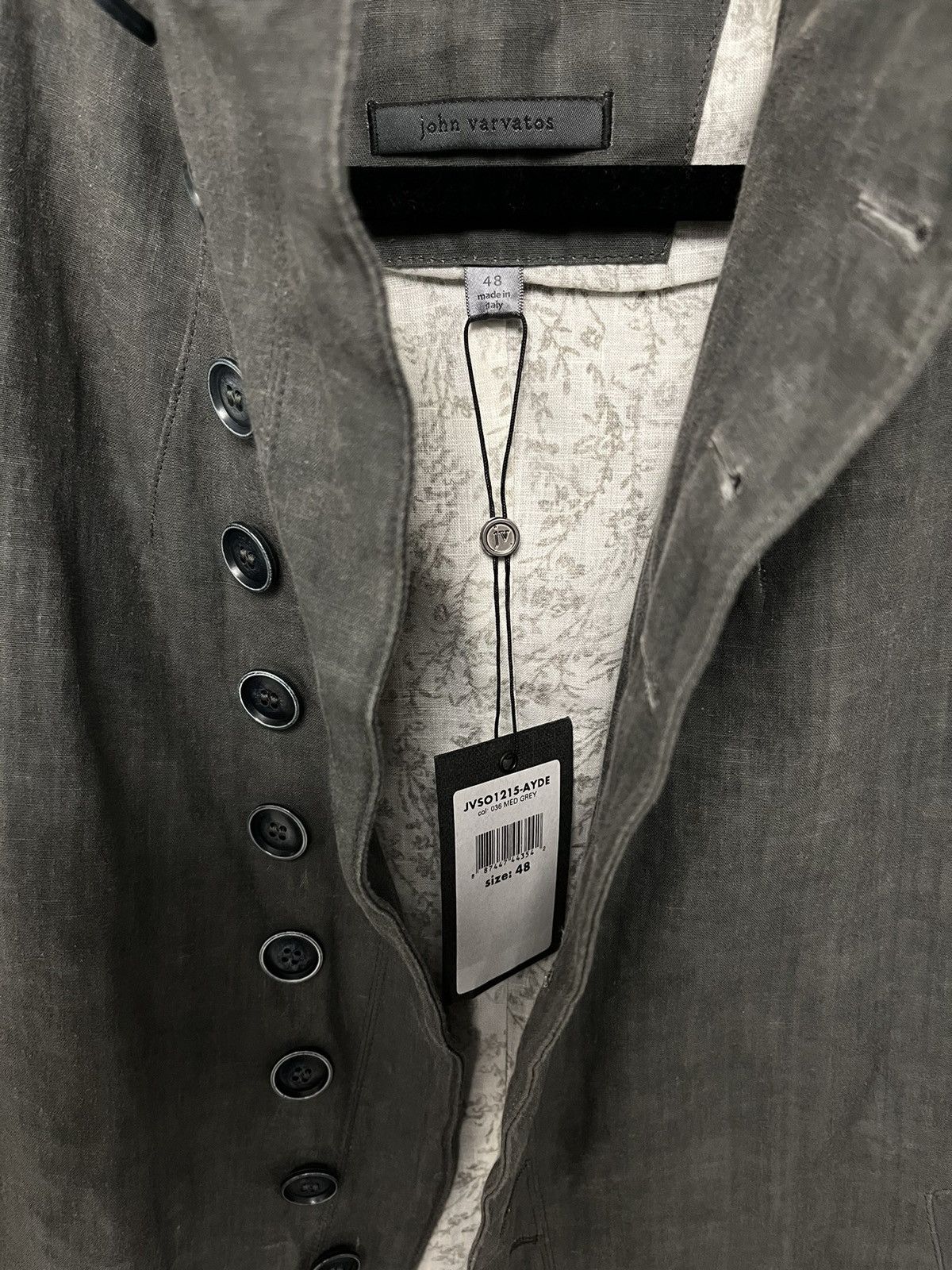 Multibutton cutaway jacket. 48