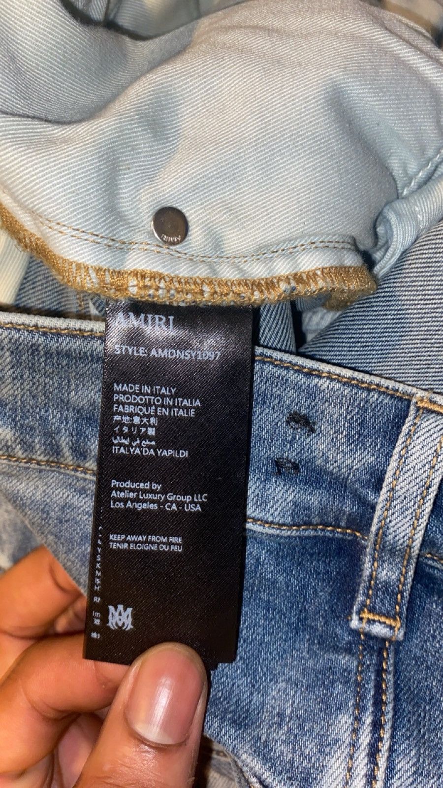 Amiri suede appliqué logo jeans