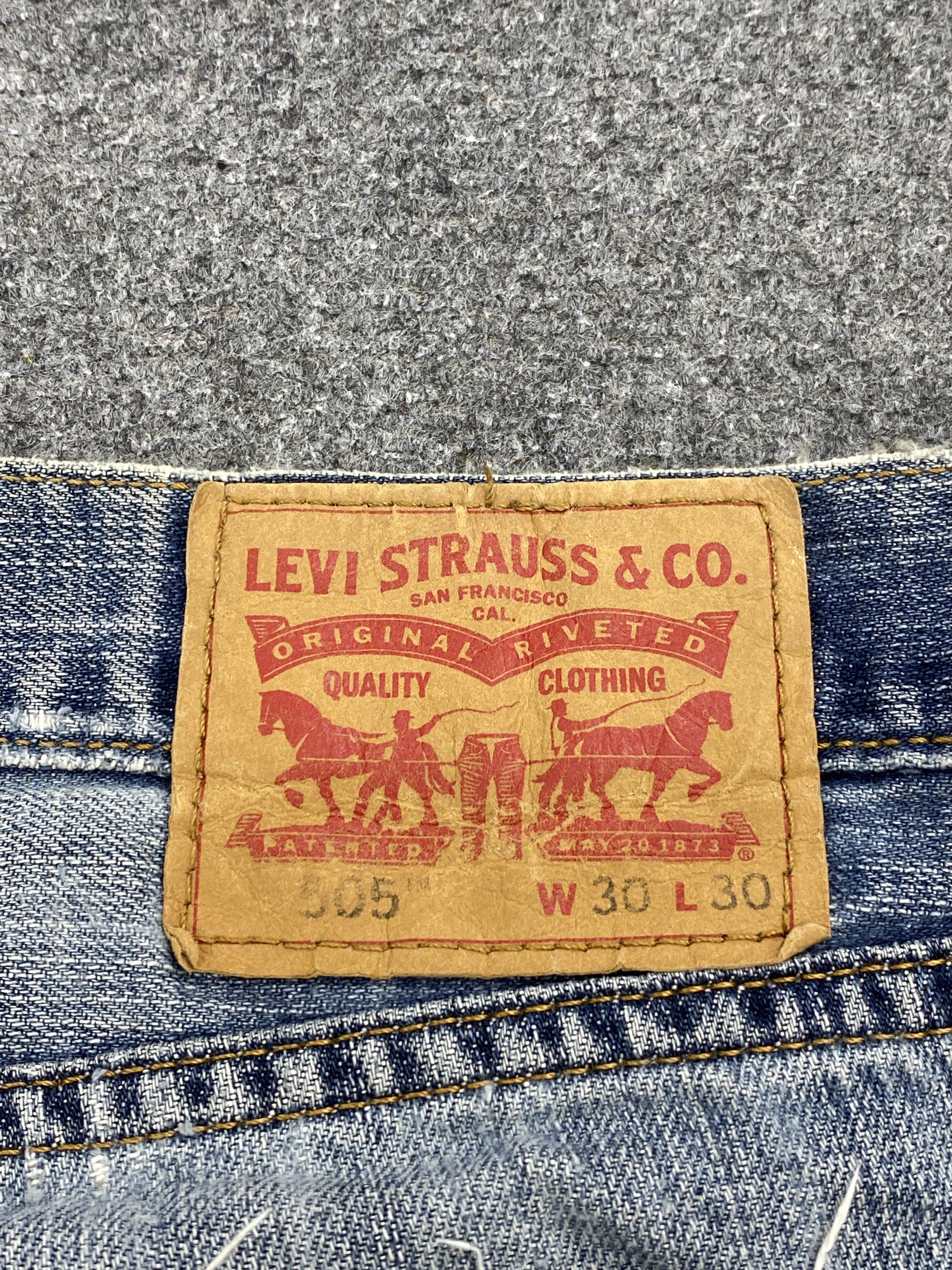 Distressed Vintage Levi's 505 Faded Blue Jeans