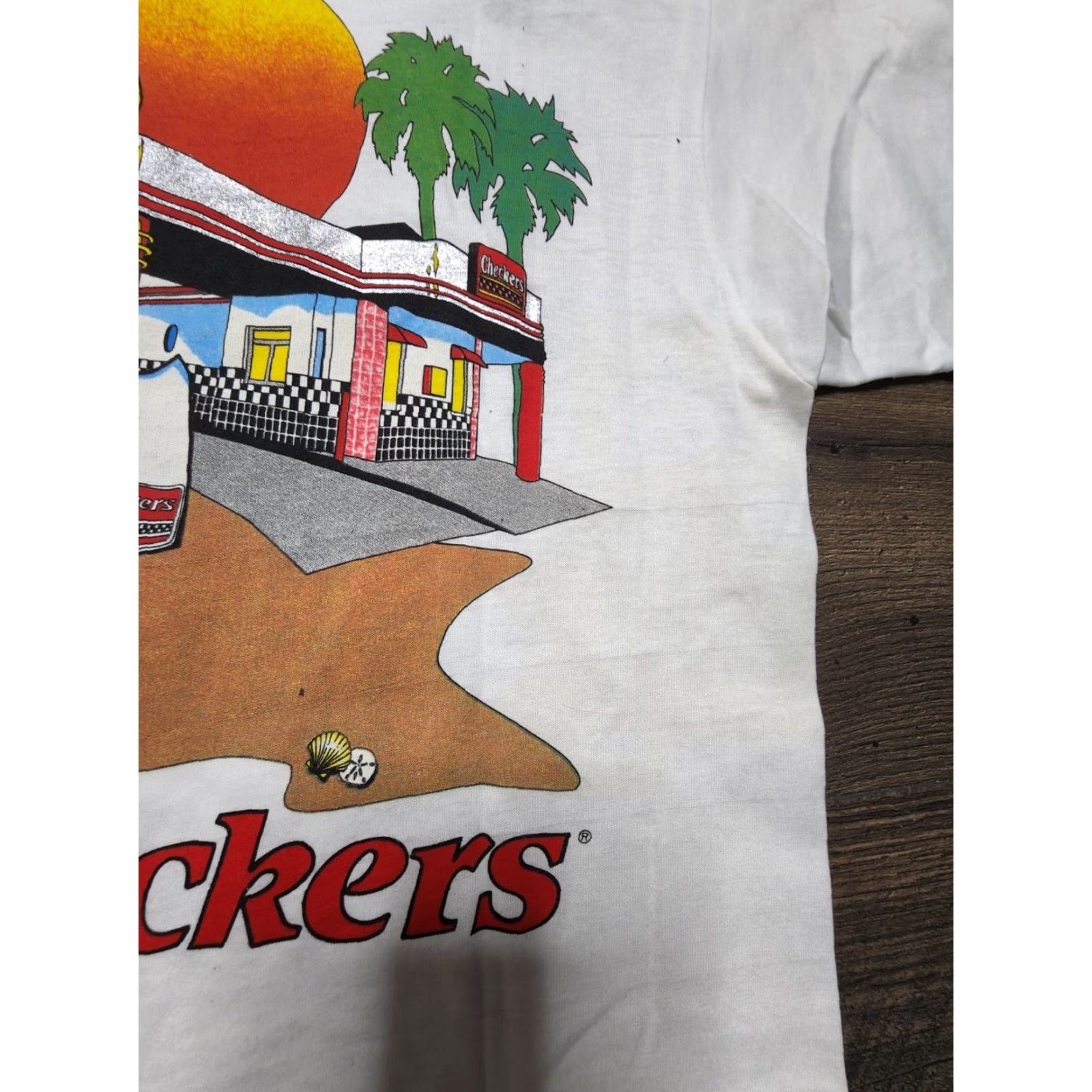 Vintage VINTAGE Screen Stars T-Shirt Mens L White 90s Retro Double-Sided Distress Checkers Fast Foot Promo Resturaunt Logo Graphic Print Shirt Men Size US L / EU 52-54 / 3 - 7 Thumbnail