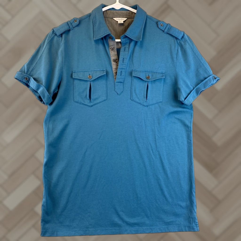 Calvin Klein Calvin Klein Polo Shirt Slim Fit Men’s Indigo 2 Front Pockets Buttoned Sleeves Shoulder Loop Accents 90-68 / 68-90? Size US S / EU 44-46 / 1 - 1 Thumbnail