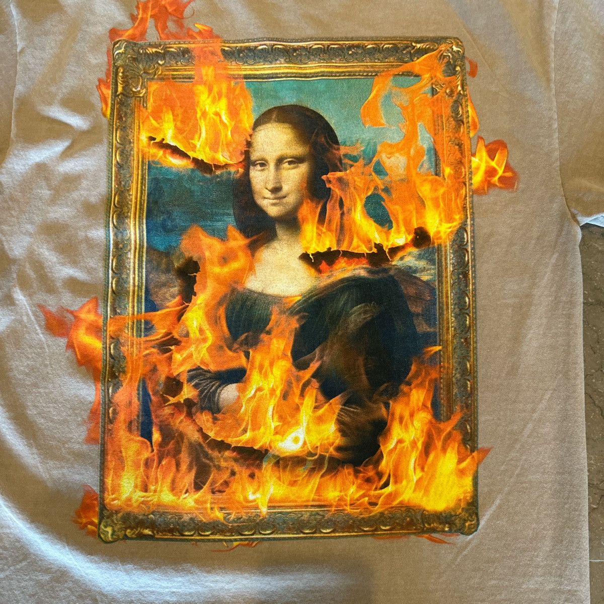 Pleasures Pleasures Mona Lisa Fire Graphic T-Shirt – Tan / Beige – M Size US M / EU 48-50 / 2 - 5 Thumbnail