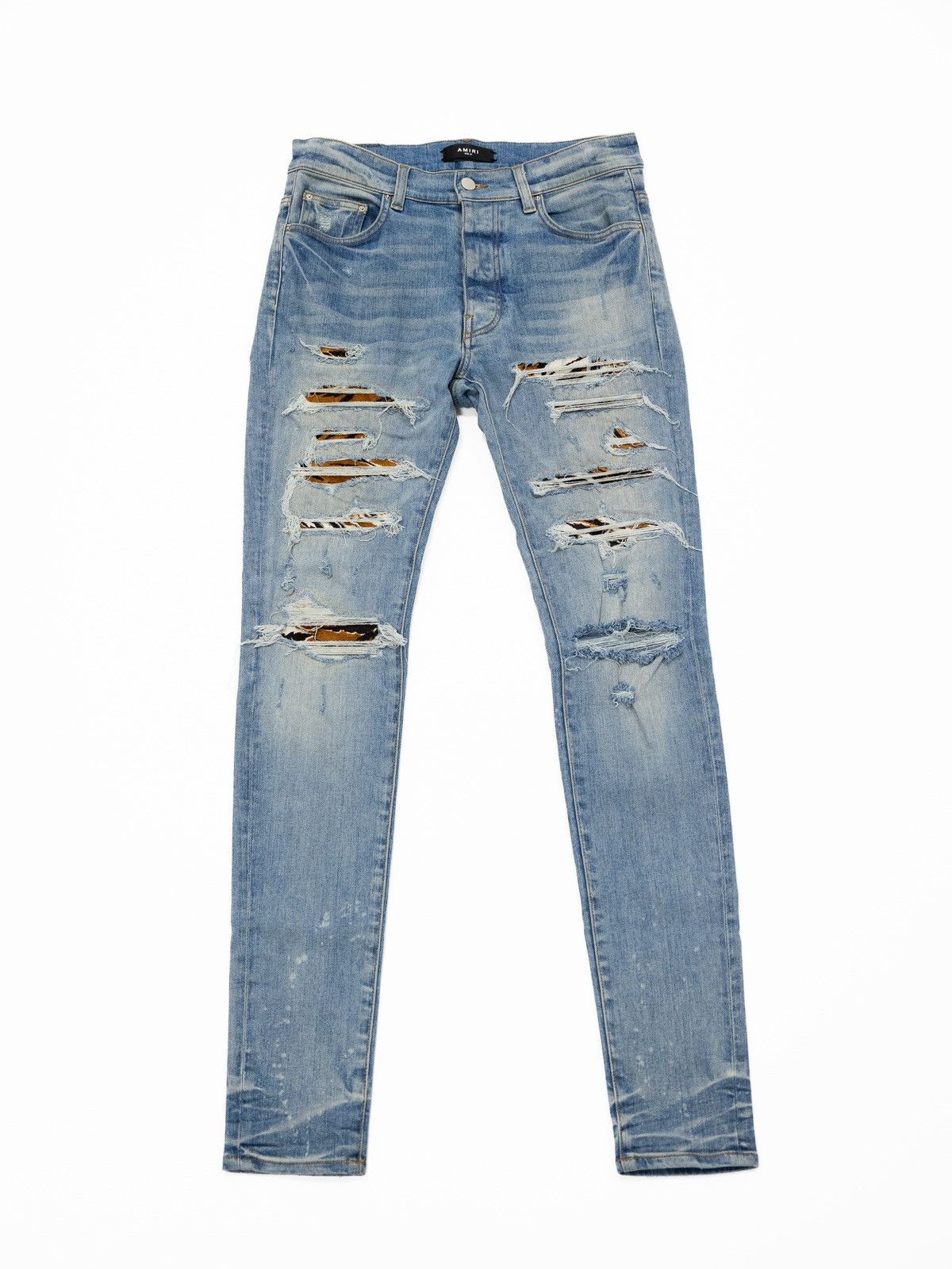 image of Amiri Animal Print Distressed Denim in Blue, Men's (Size 31)