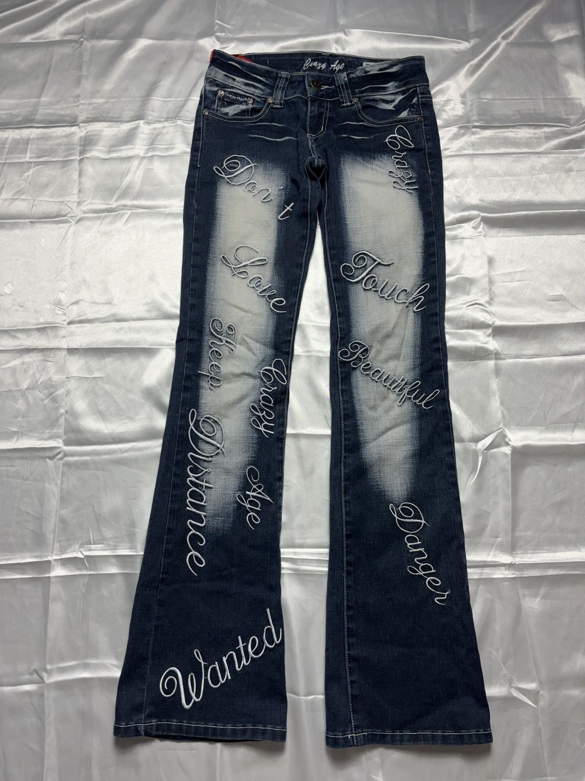 “Don’t touch” faded printed vintage flared denim jeans pants