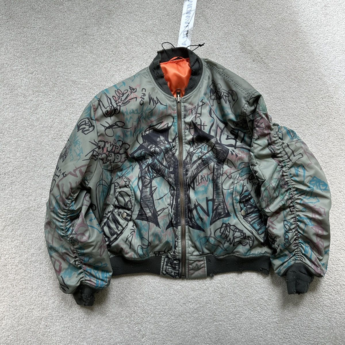 image of Mowalola Graffiti Distressed Bomber in Green, Men's (Size Medium)