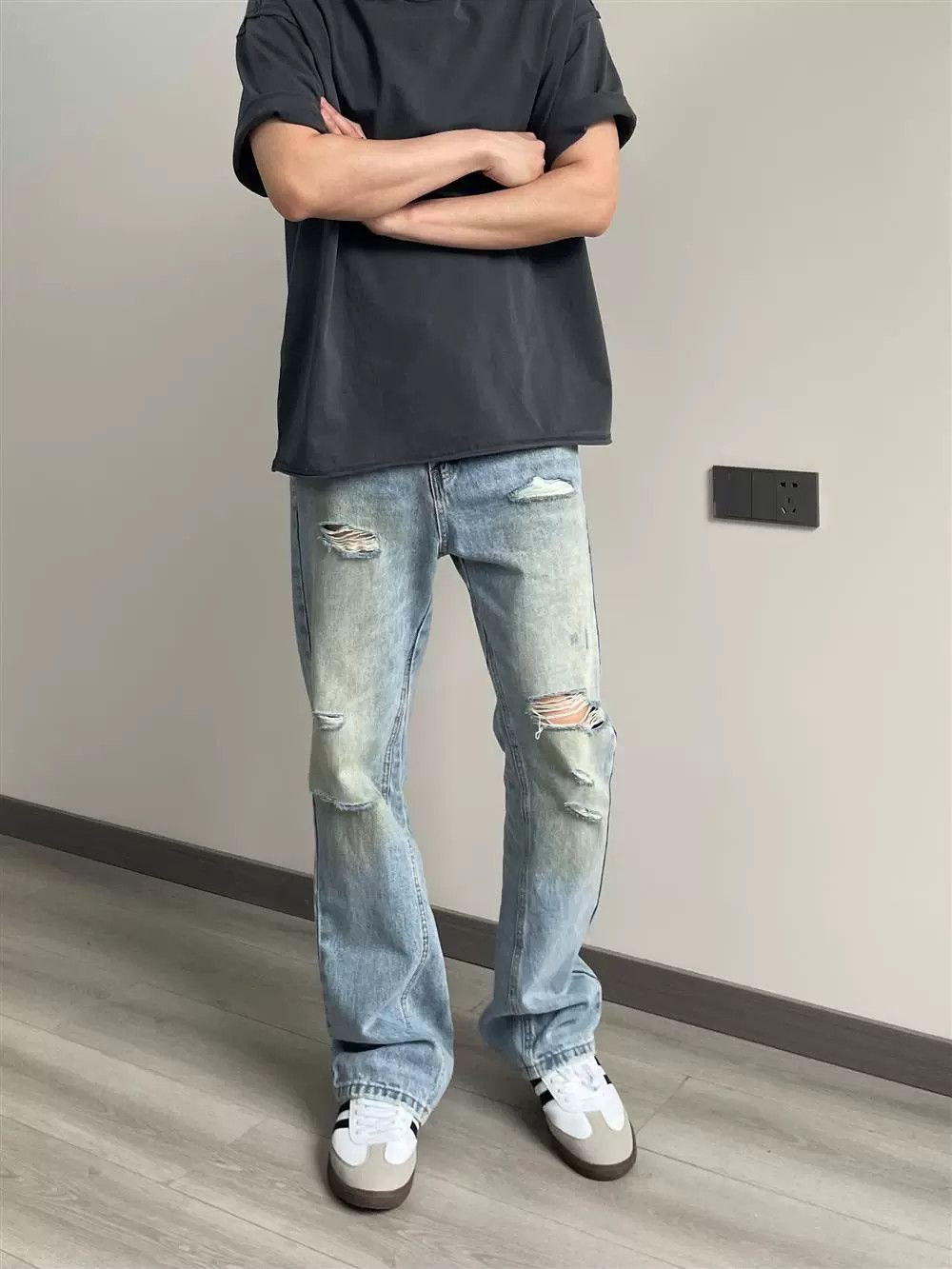 damaged dirty washed flared ripped jeans