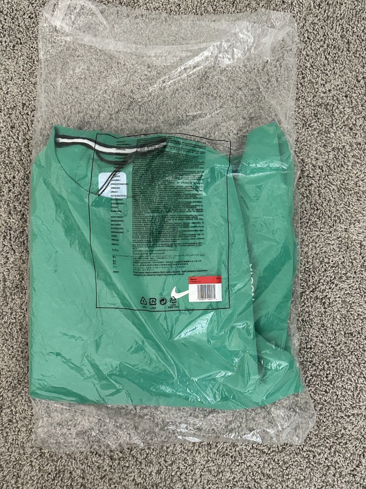 image of Nike Nocta Tech Fleece Crew in Green, Men's (Size Large)