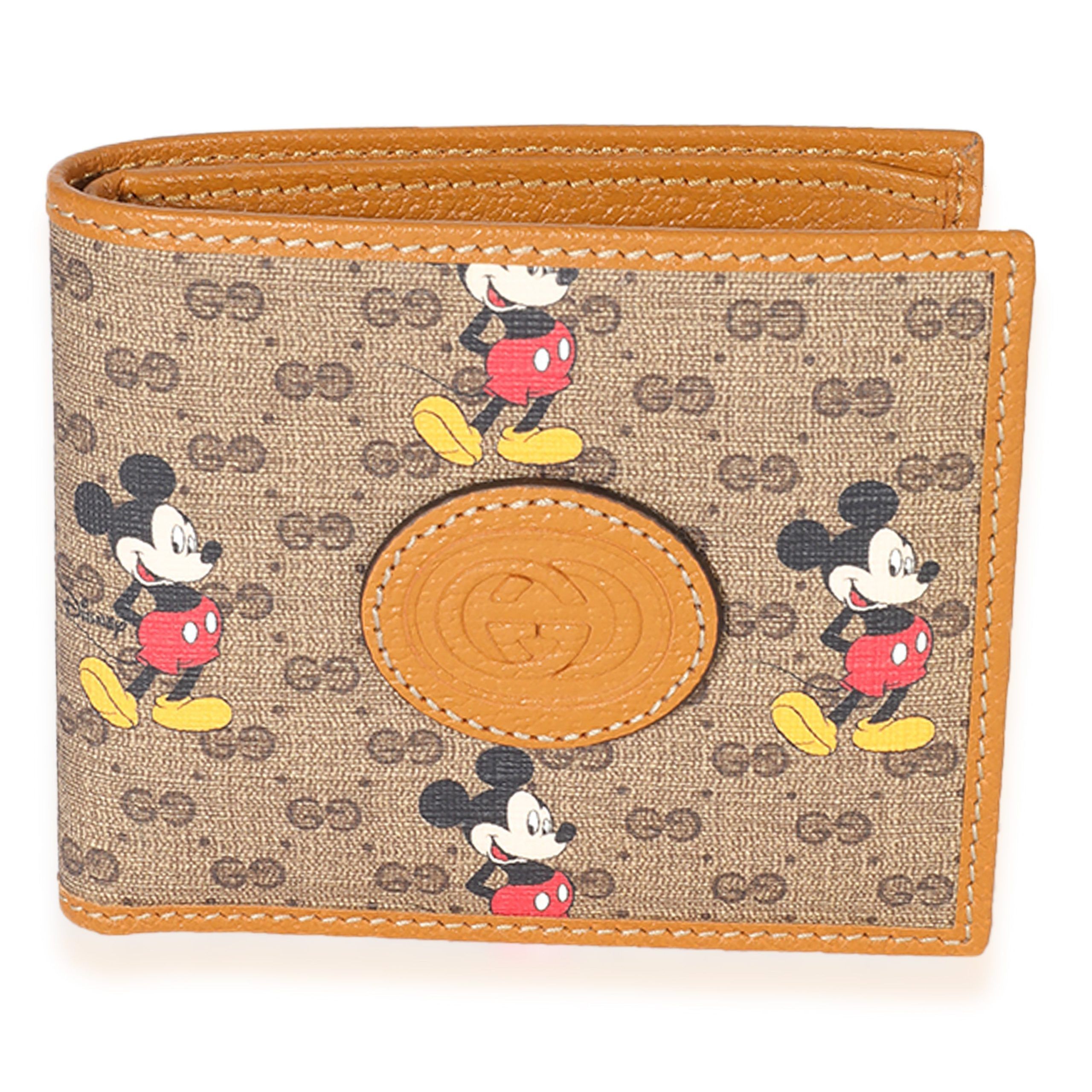 image of Gucci X Disney Vintage GG Supreme Mickey Mouse Bifold Wallet in Brown, Women's
