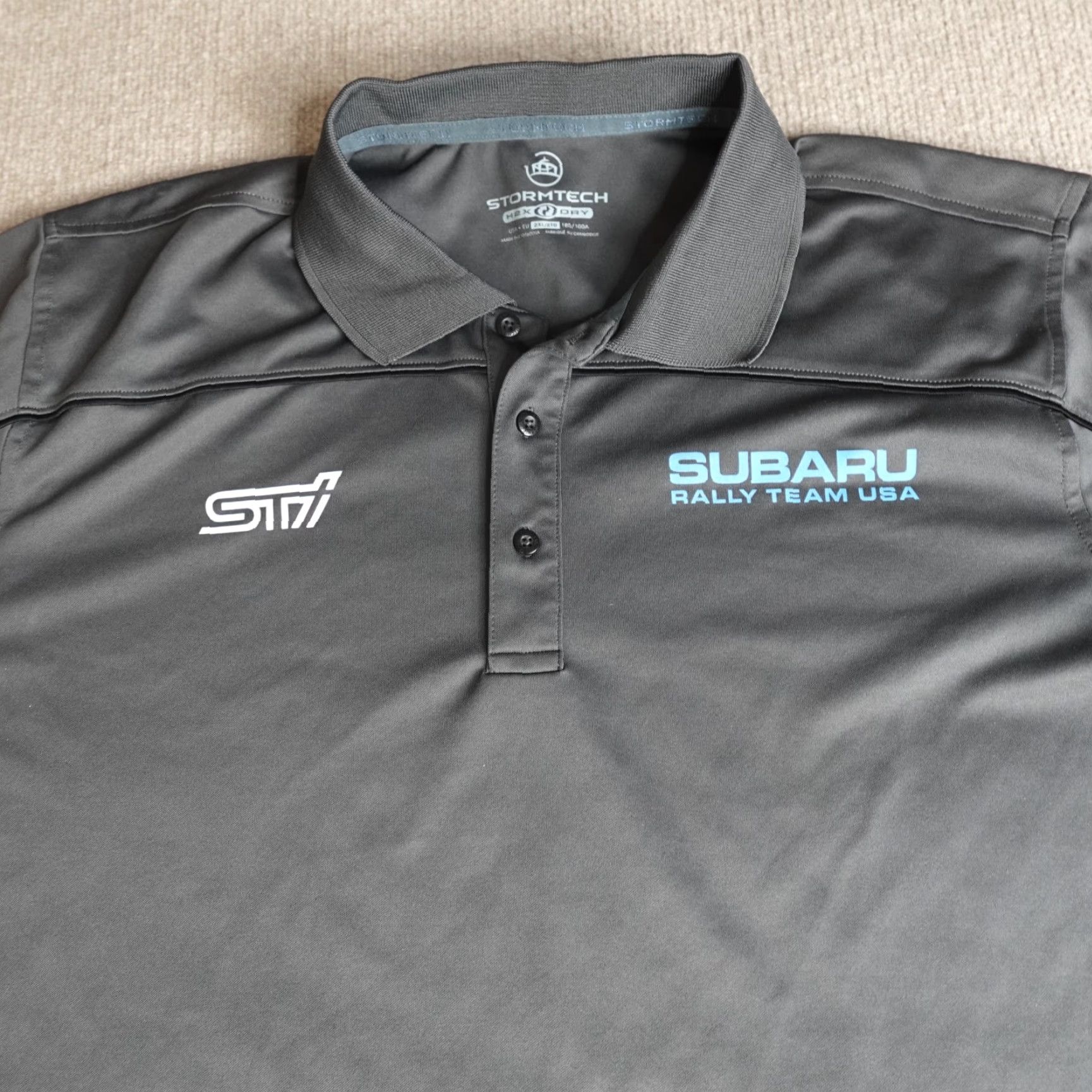 Stormtech Subaru STI Polo Shirt 2XL Gray Racing Sponsors Stormtech Polo Mens Short Sleeve Button-Down Collar 2XL Gray Stormtech Size US XXL / EU 58 / 5 - 7 Thumbnail
