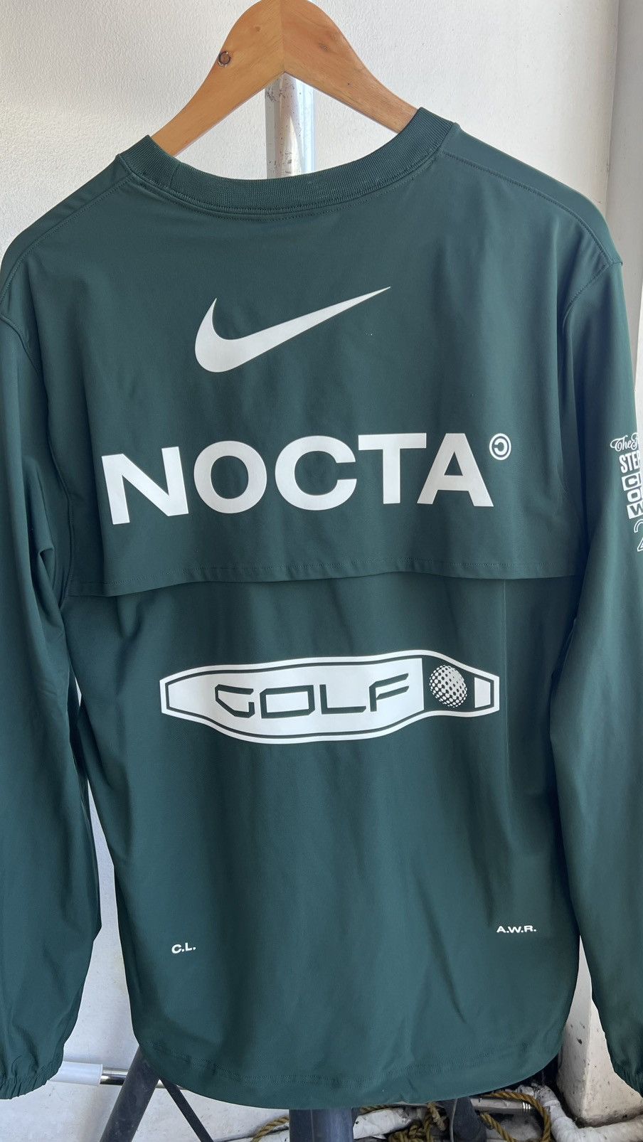 NOCTA NIKE ゴルフ ナイキ × ドレイク ノクタ ゴルフ クルーネック トップ グリーン