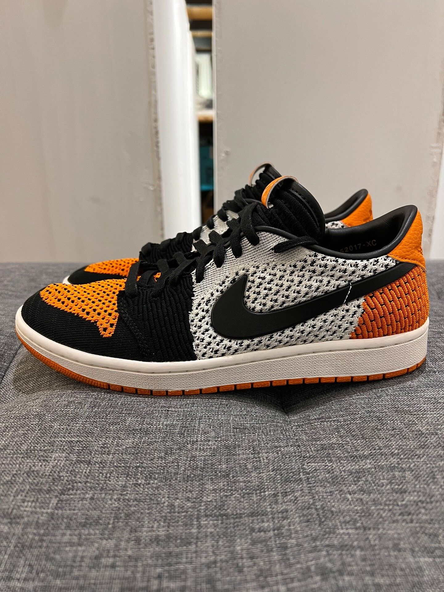 Jordan Brand aj1 low flyknit black orange sneakers Size US 9.5 / EU 42-43 - 1 Thumbnail