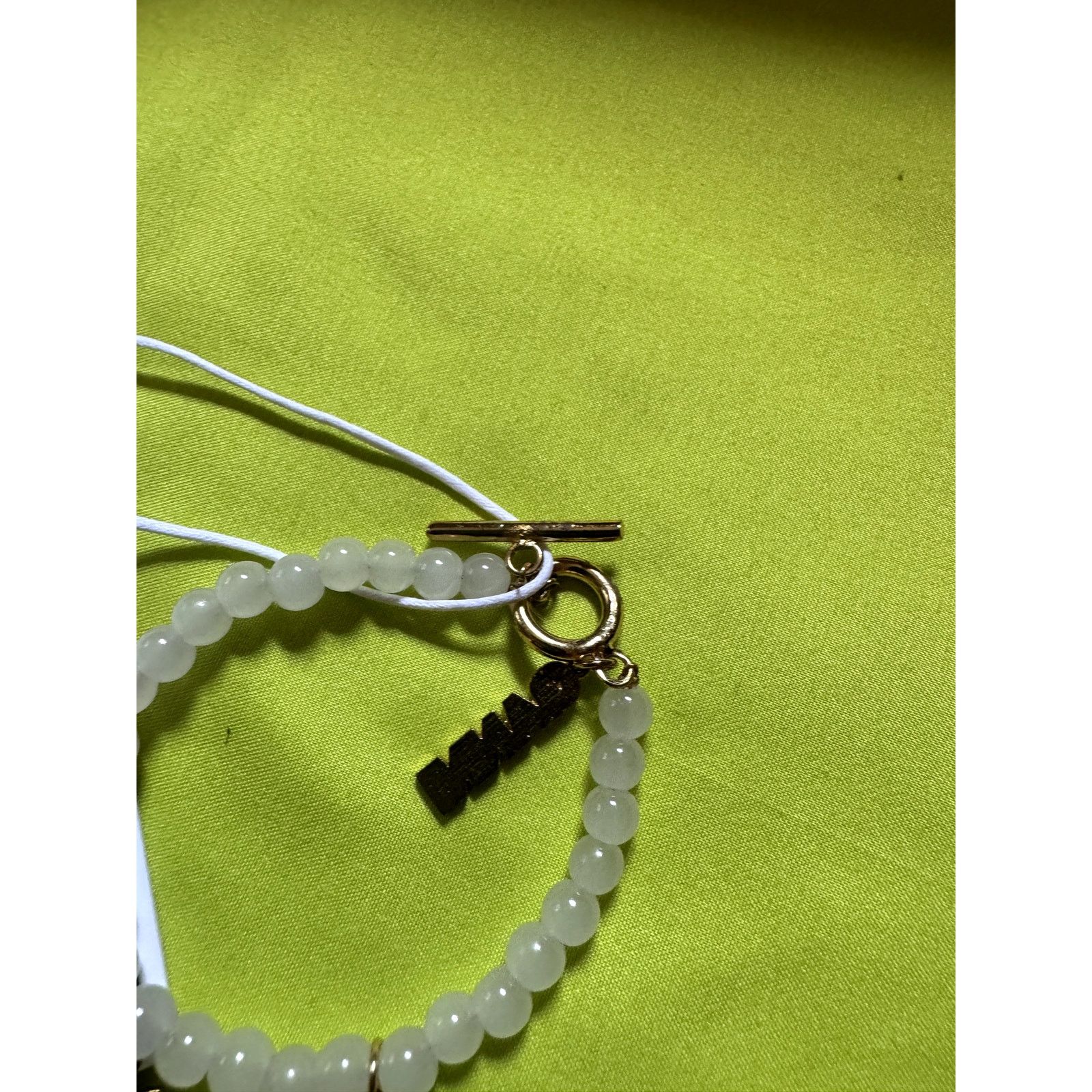 Ganni Ganni White beaded bracelet with gold charms Size ONE SIZE - 11 Thumbnail