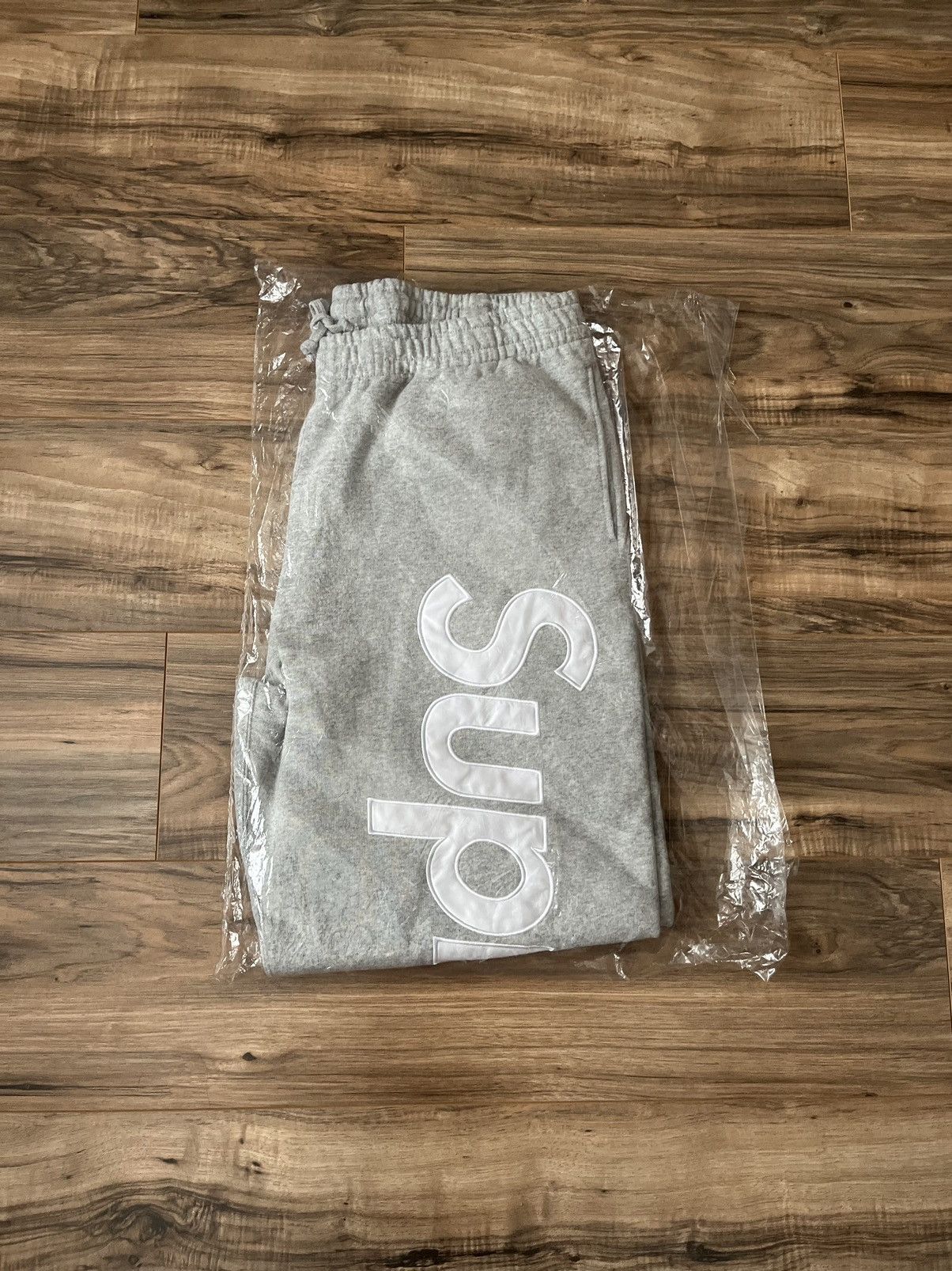 Image of Supreme Satin Appliqué Sweatpant in Heather Grey, Men's (Size 36)