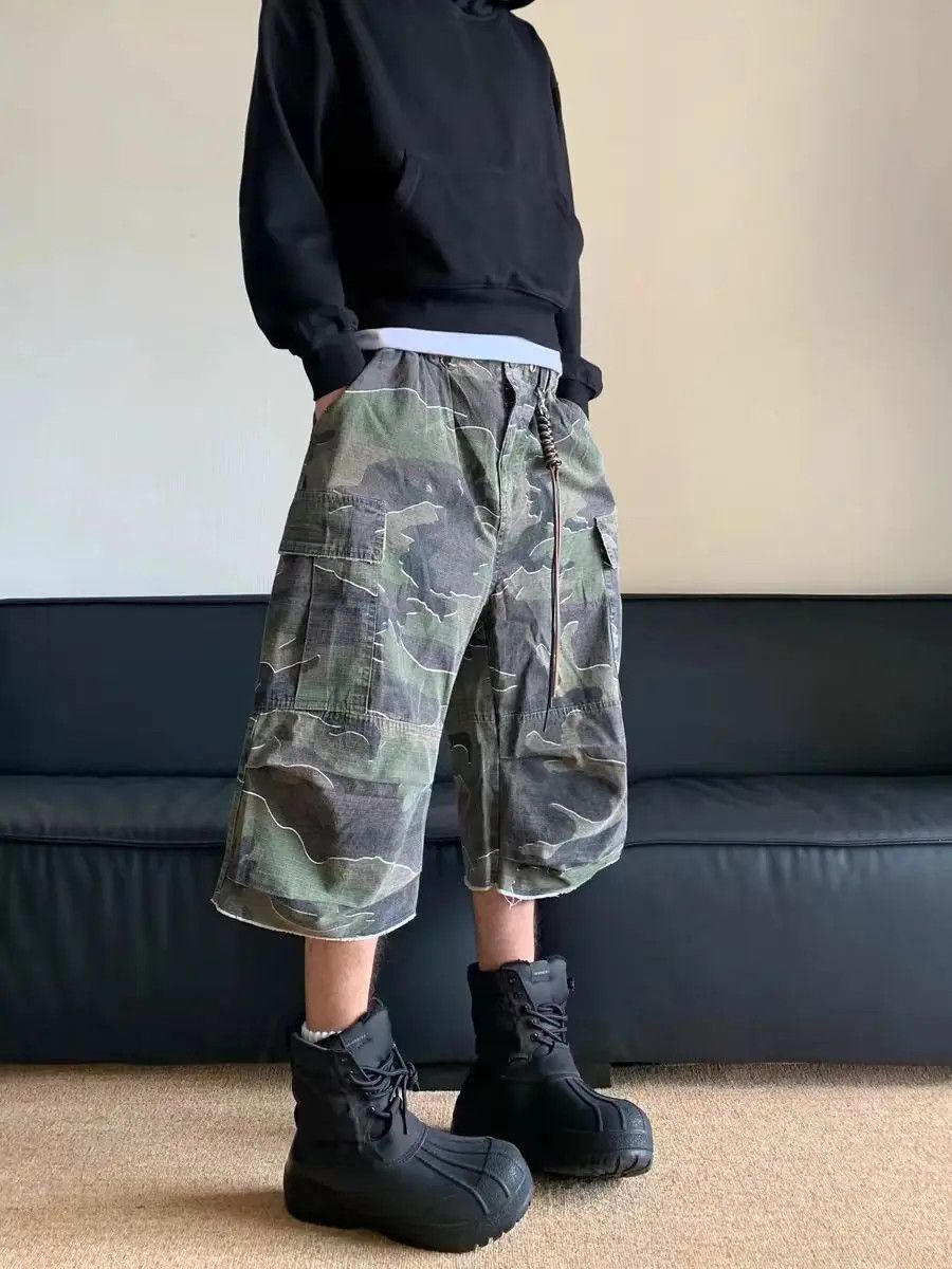 Vintage washed and distressed camouflage baggy shorts