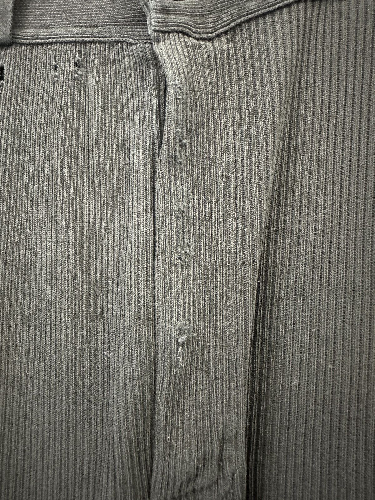 Distressed-effect trousers