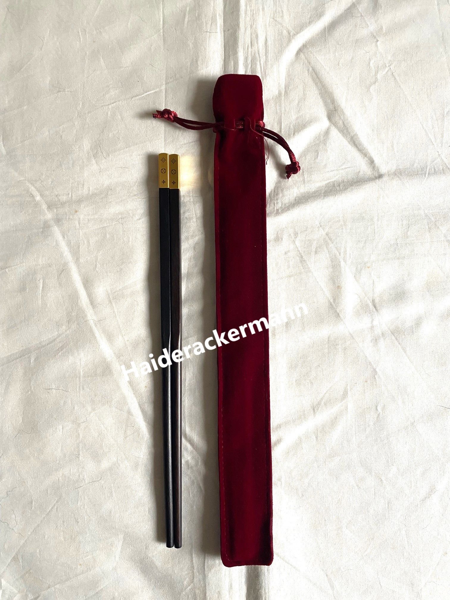 image of Louis Vuitton 2024 Fw Men Show Monogram Chopsticks in Brown