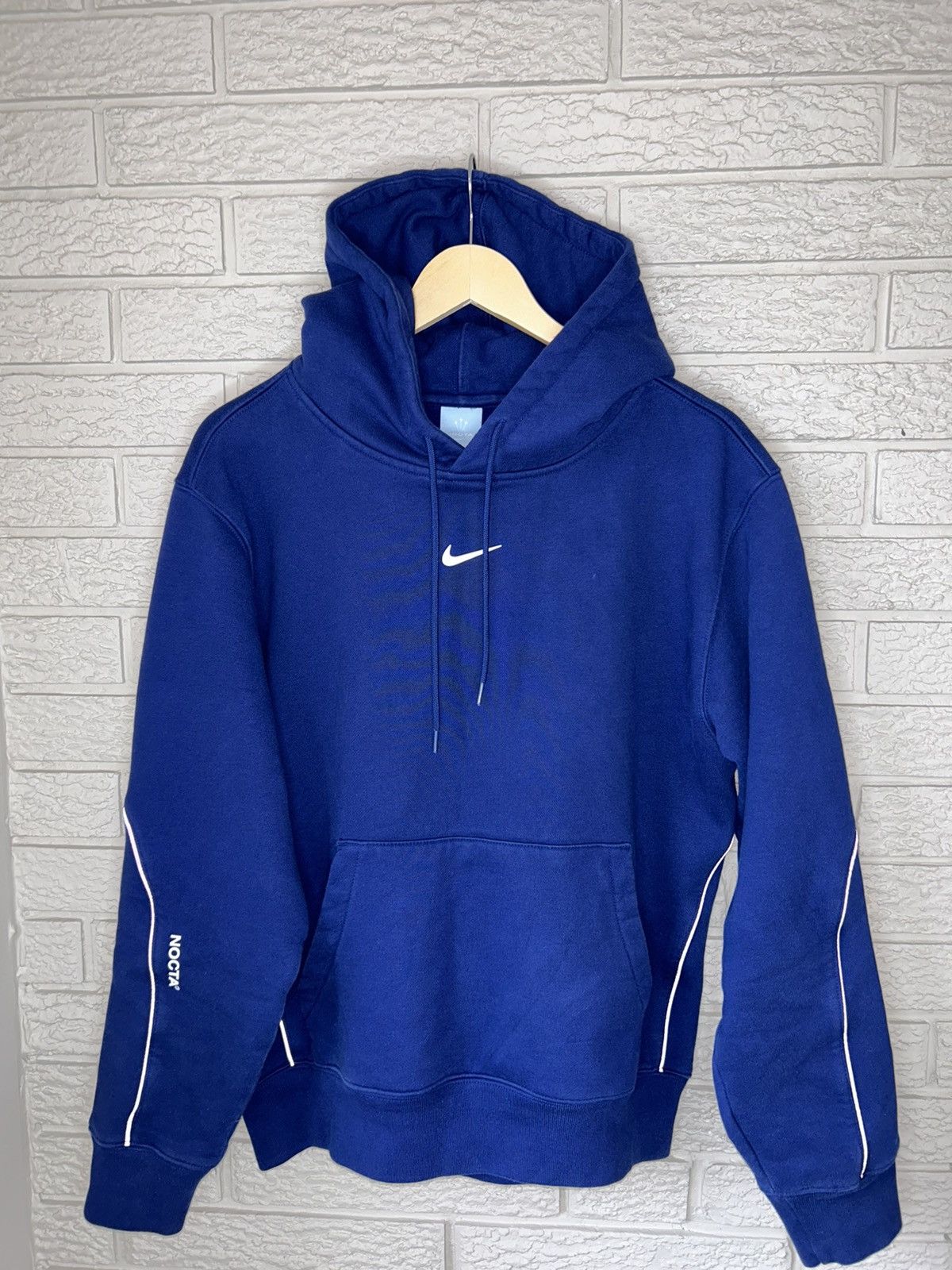 image of Nocta Center Swoosh Cardinal Hoodie Drake in Blue, Men's (Size Medium)
