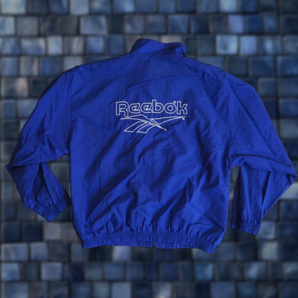 Reebok VTG Reebok Track Jacket Windbreaker Royal Blue Logo Zip Short Sleeve Womens L Blue 80s 90s Athletic Running Jogging Pockets Vintage Size L / US 10 / IT 46 - 1 Thumbnail