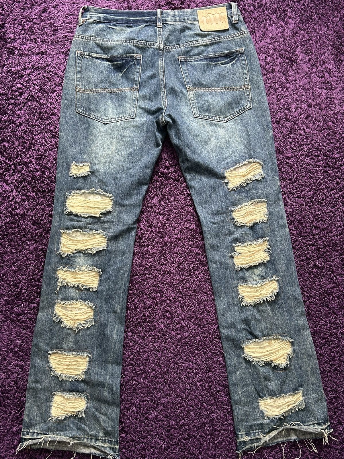 Racer worldwide distressed jeans
