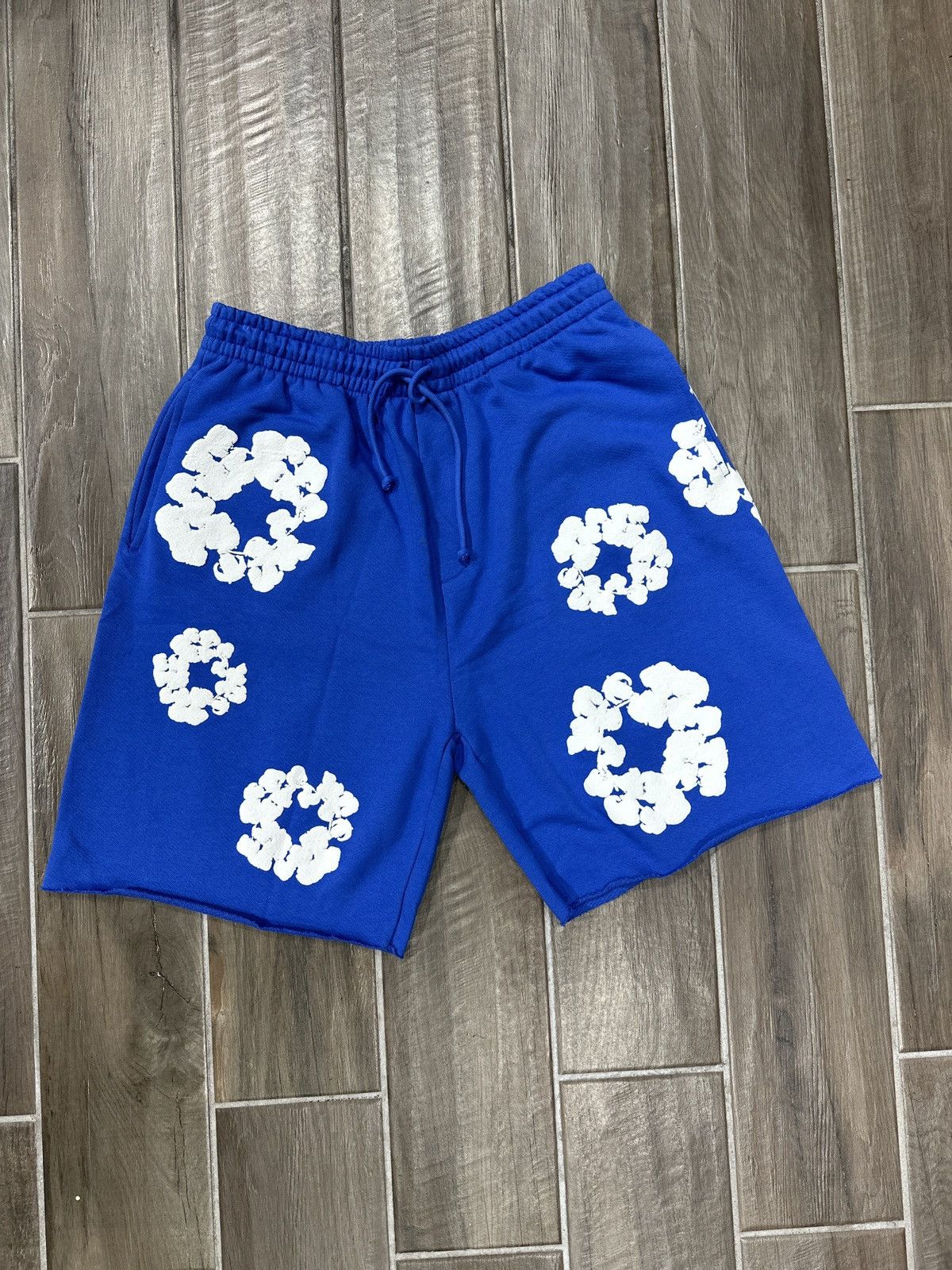 DENIM TEARS Denim Tears Cotton Wreath Blue Sweat Shorts | Grailed