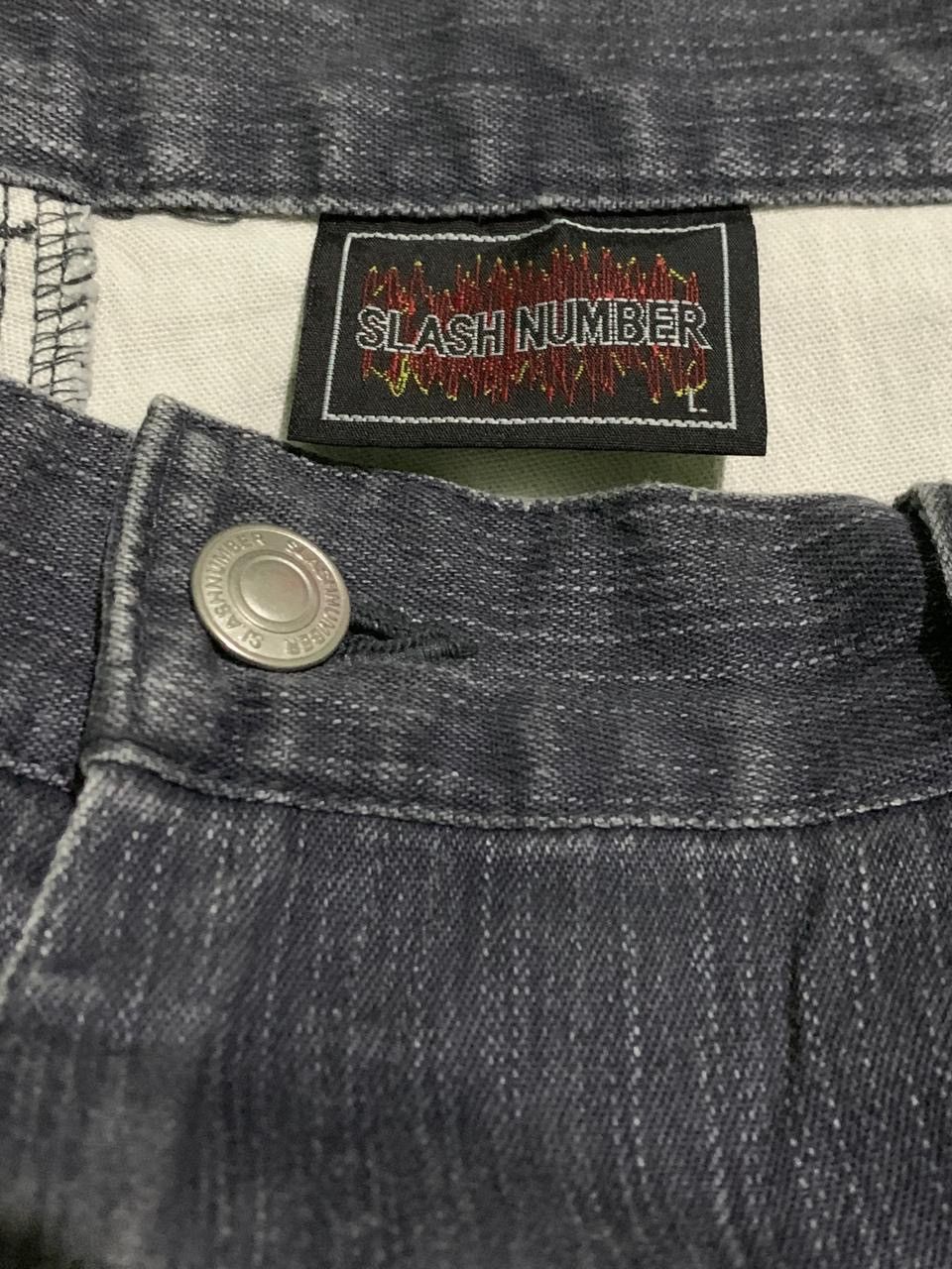 Japanese brand slash number denim pants