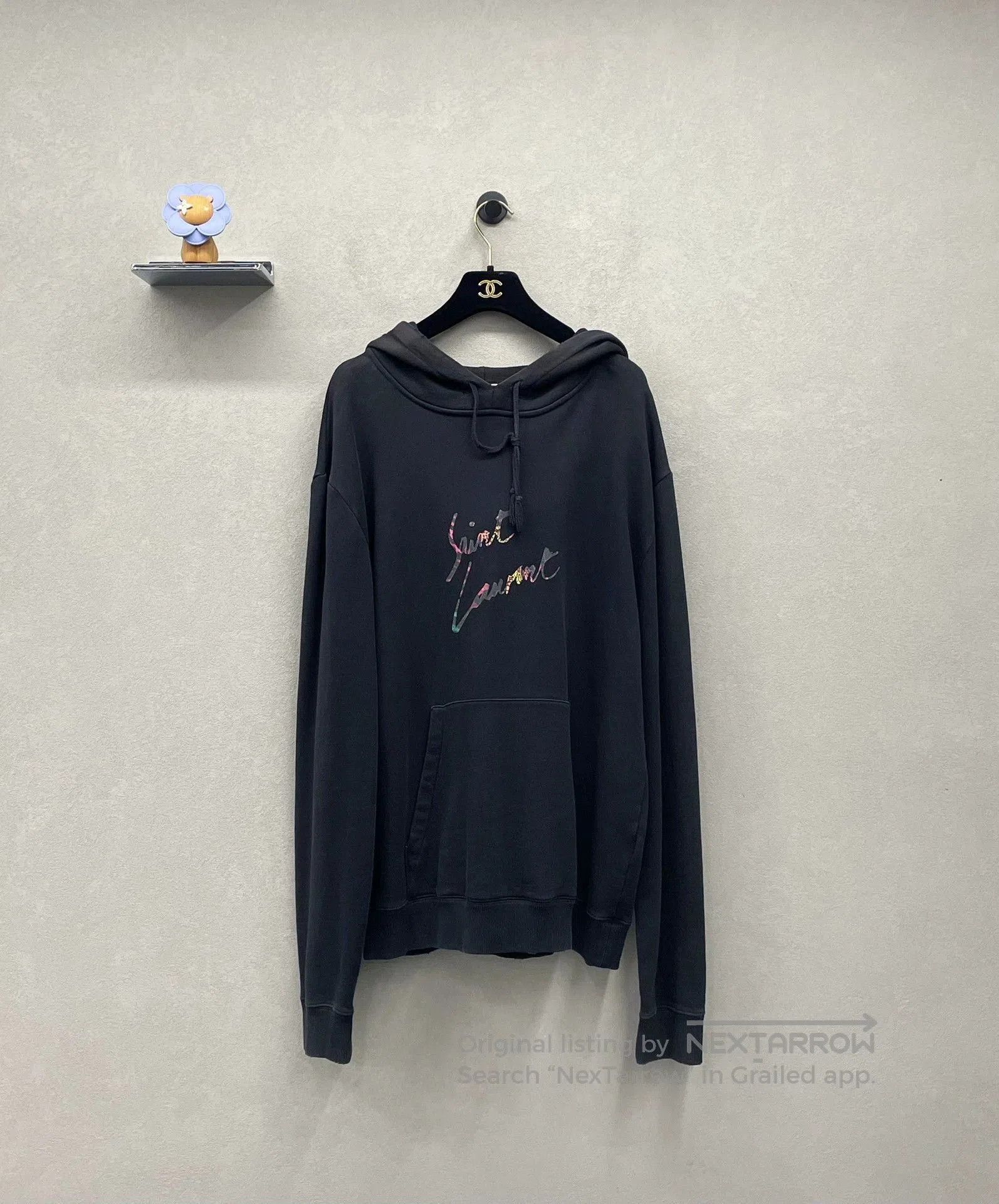 black hoodie with rainbow logo design.