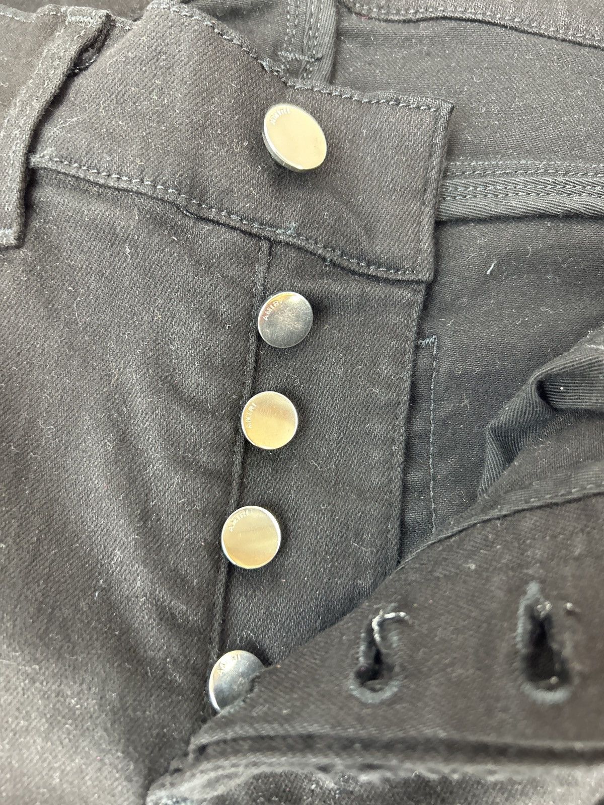 AMIRI MX1 CRACKED PAINT JEANS AGED BLACK/PINK