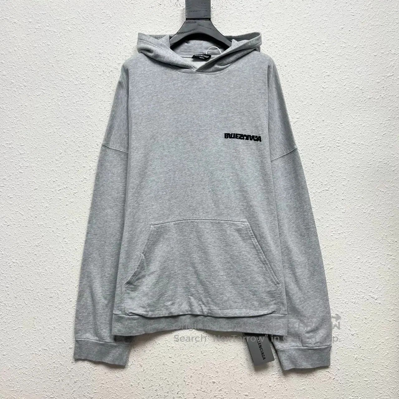 balenciaga inverted logo embroidered hoodie.