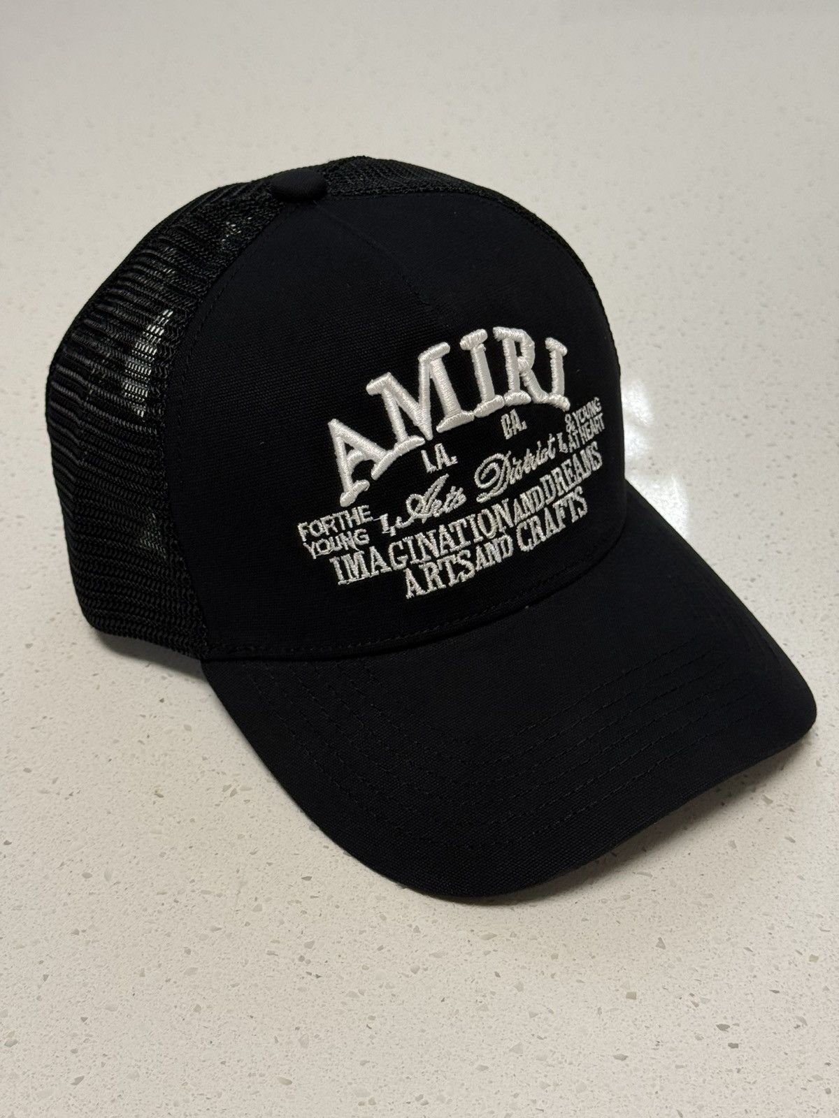 AMIRI ARTS DISTRICT TRUCKER HAT