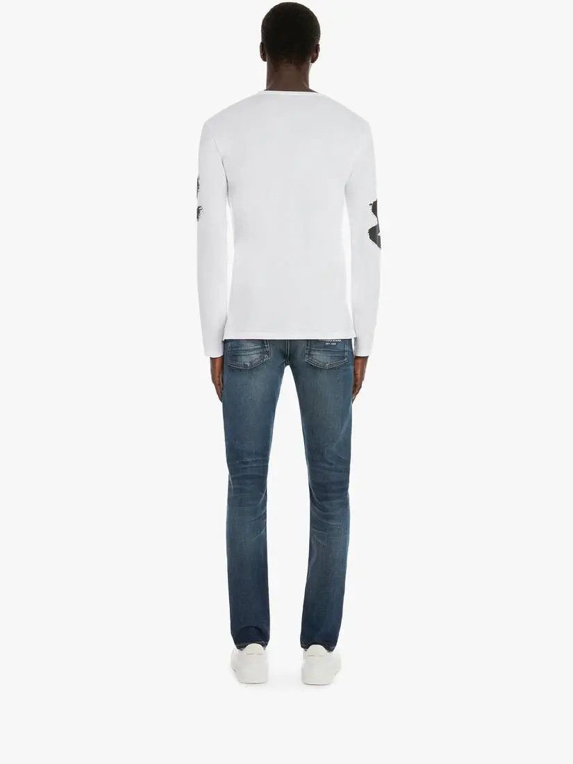 o1w1db10925 Mcqueen Graffiti Denim Jeans in Washed Blue