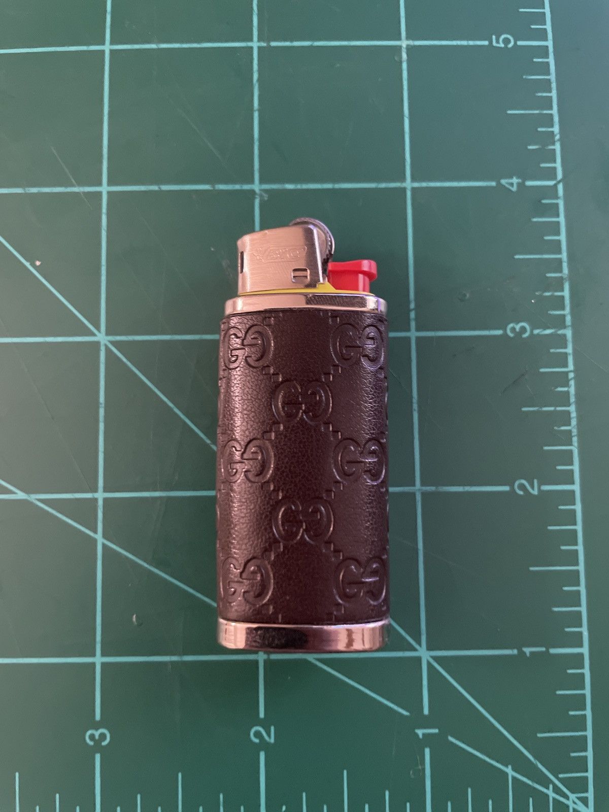 Gucci Gucci mini-bic lighter case | Grailed