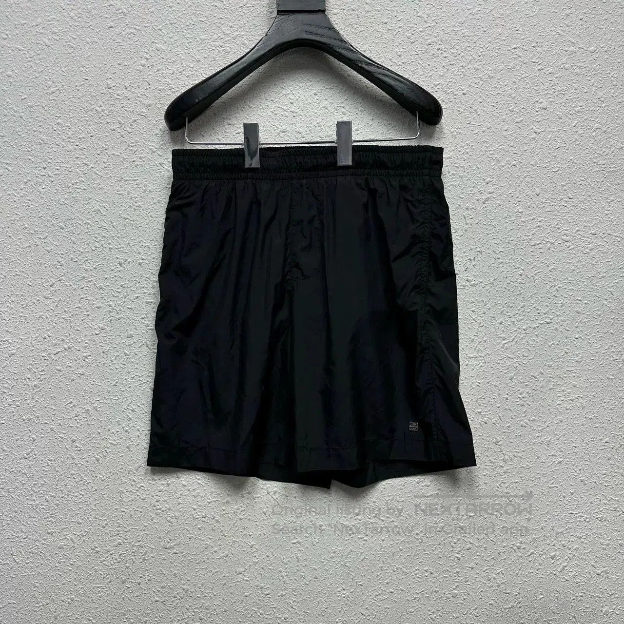 Givenchy Black Shorts with Metal Logo.